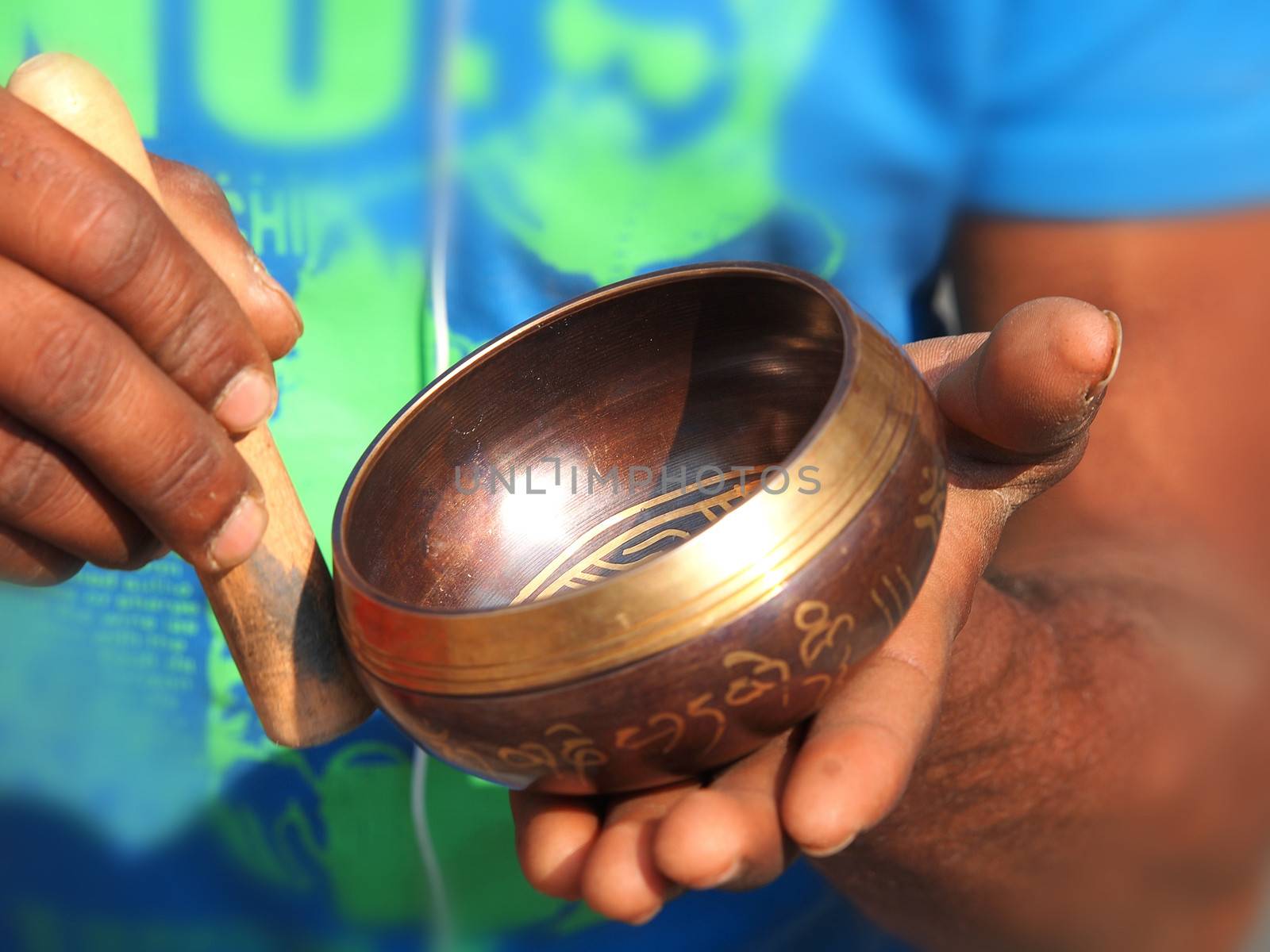 singing bowl in the hands of prayer       