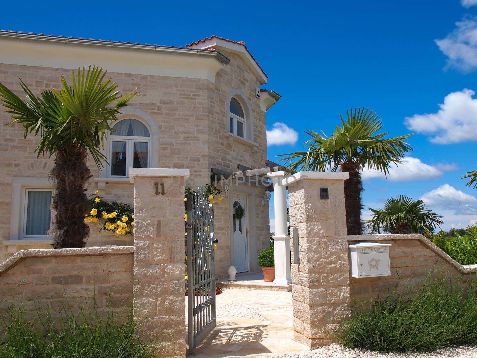 stone house with open gate