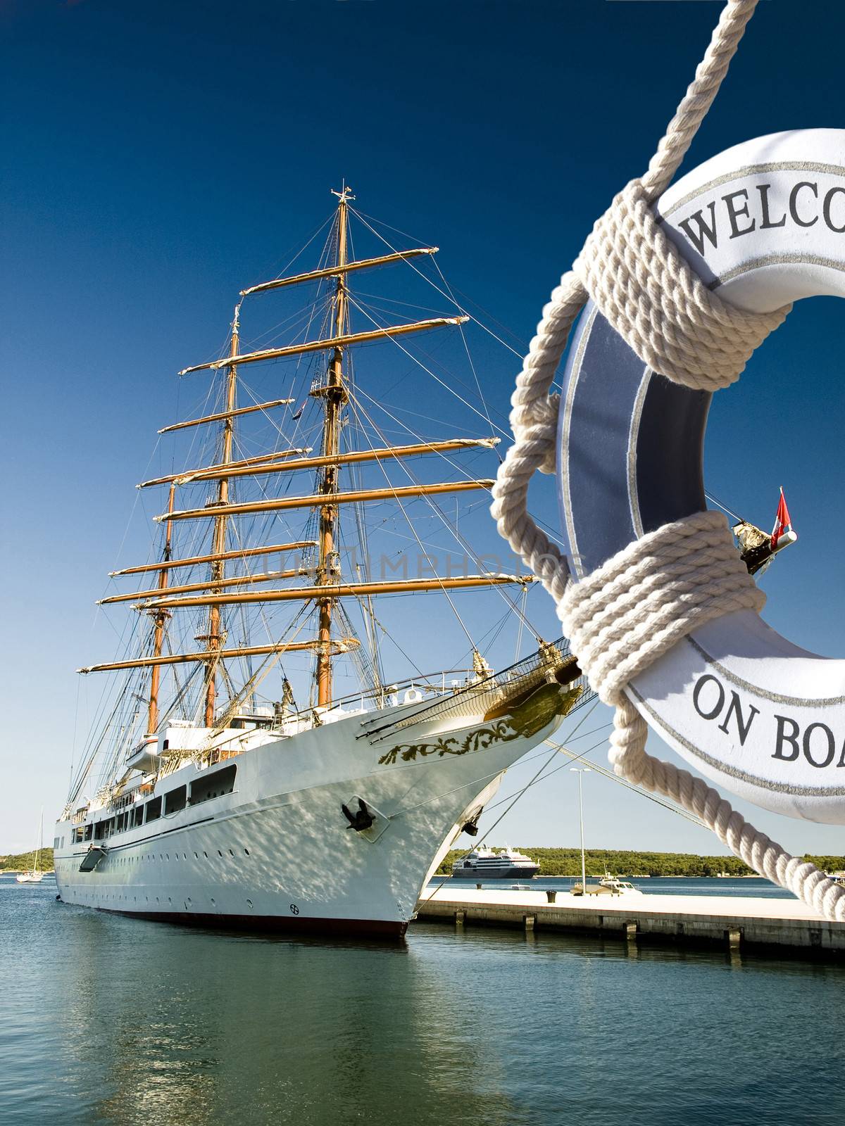 view on the sailing ship thrue blue safe belt with welcome on board sign