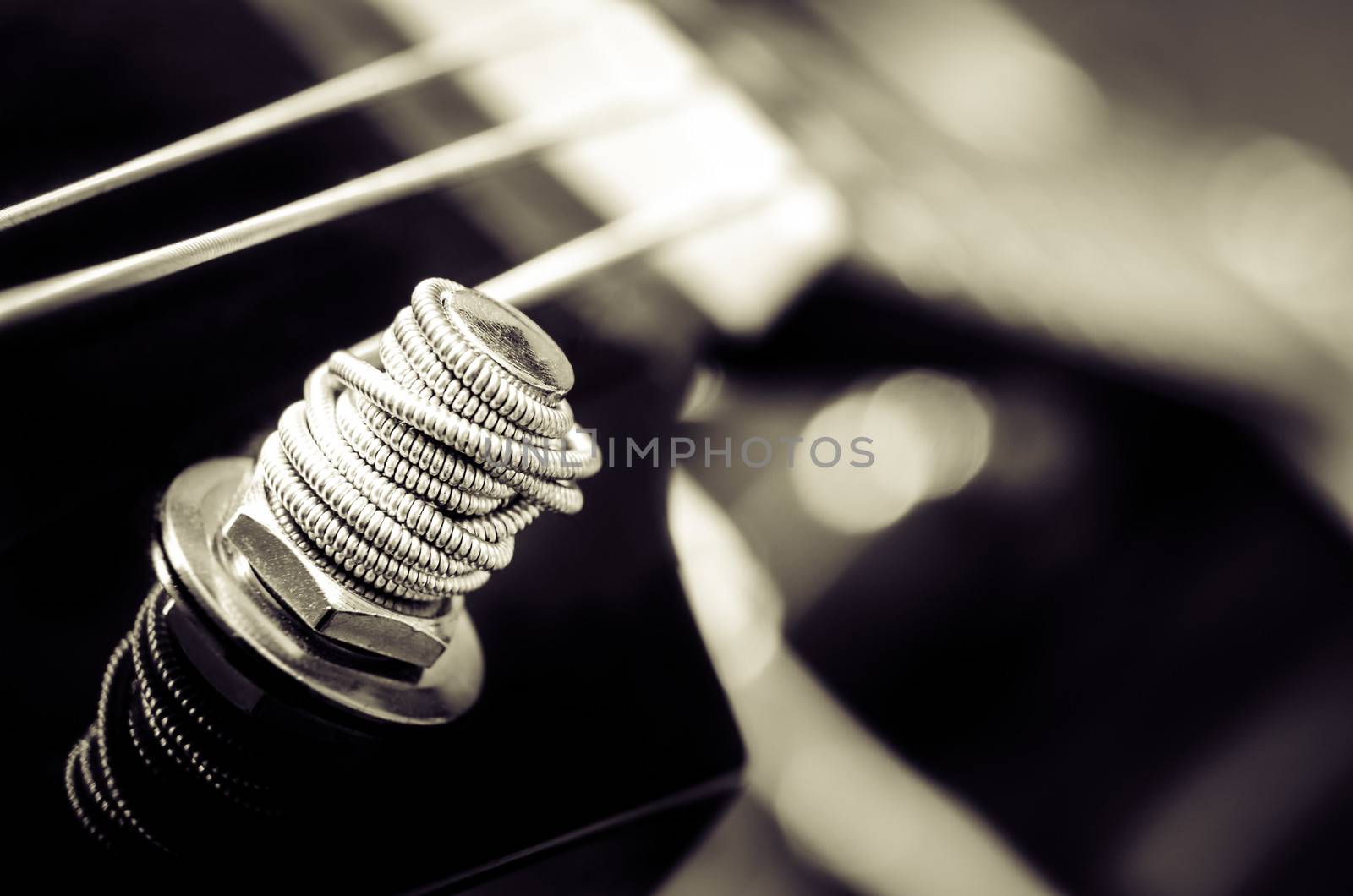 Close up detail of guitar string in monochrome by martinm303