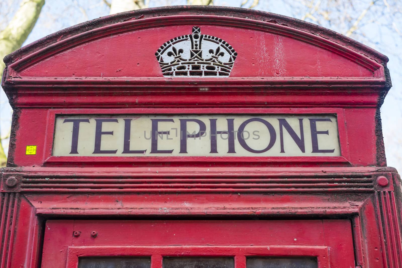 Close up of old red telephone booth in London, UK