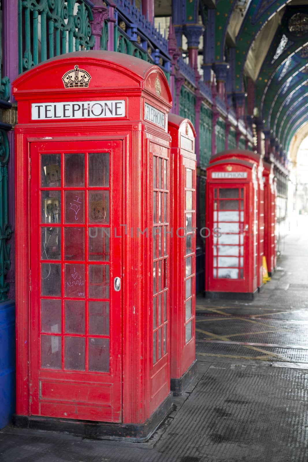 Old red telephone booth in Smithfield meat market in London, UK