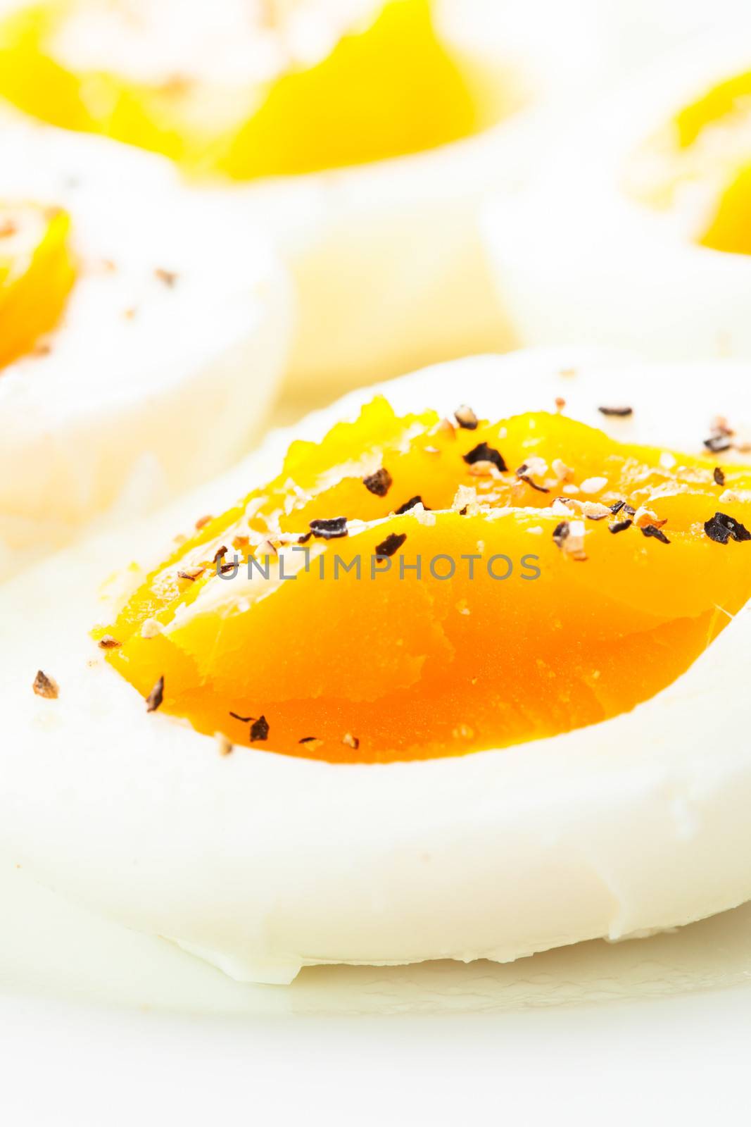 Fresh boiled eggs with spices close up