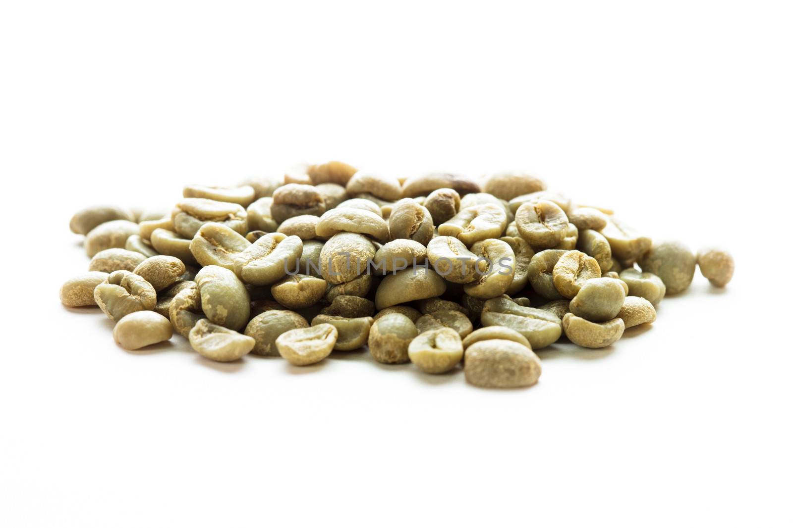 Green coffee beans heap isolated on white