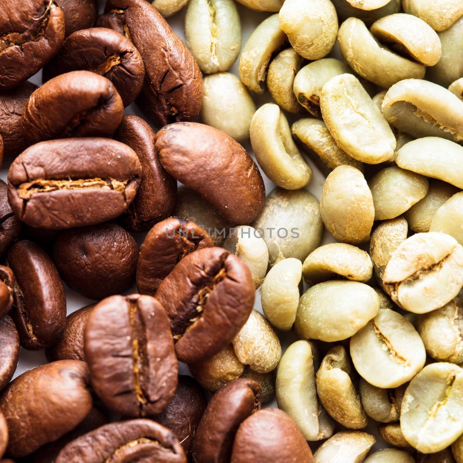 Black and green coffee beans as a background. Various types of coffee