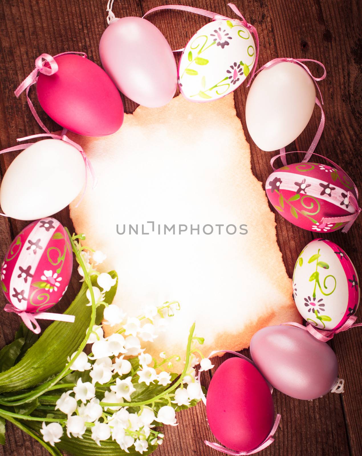 Purple and white eggs and empty greeting card. Easter decorations