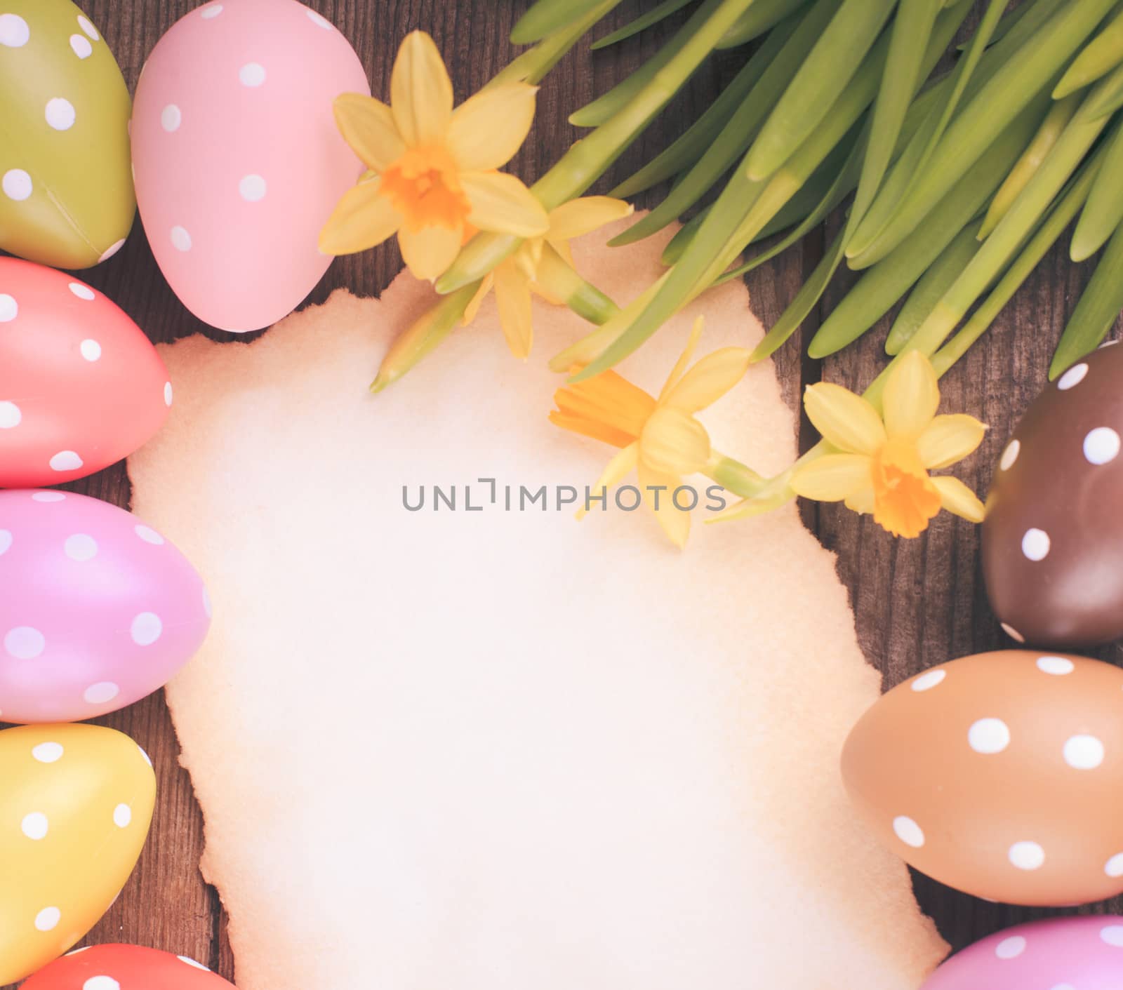 Colorful polka dot eggs and empty greeting card. Easter decorations