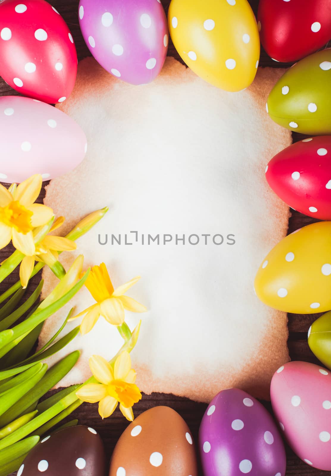 Colorful polka dot eggs and empty greeting card. Easter decorations