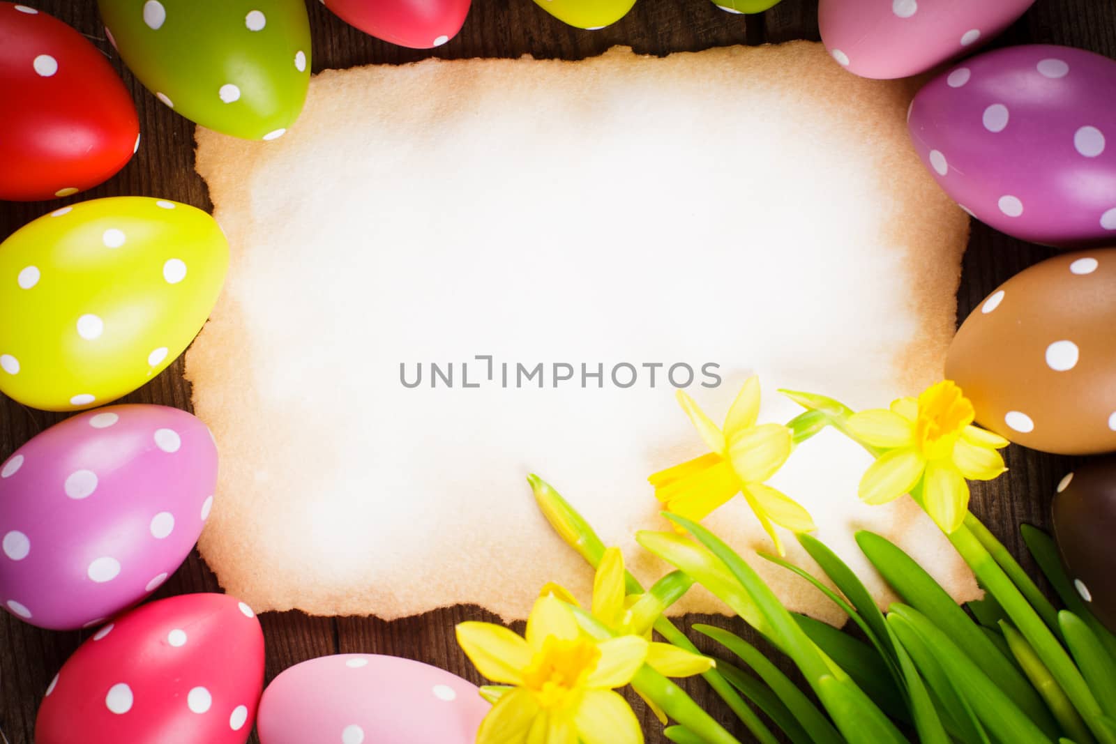 Colorful polka dot eggs and empty greeting card. Easter decorations