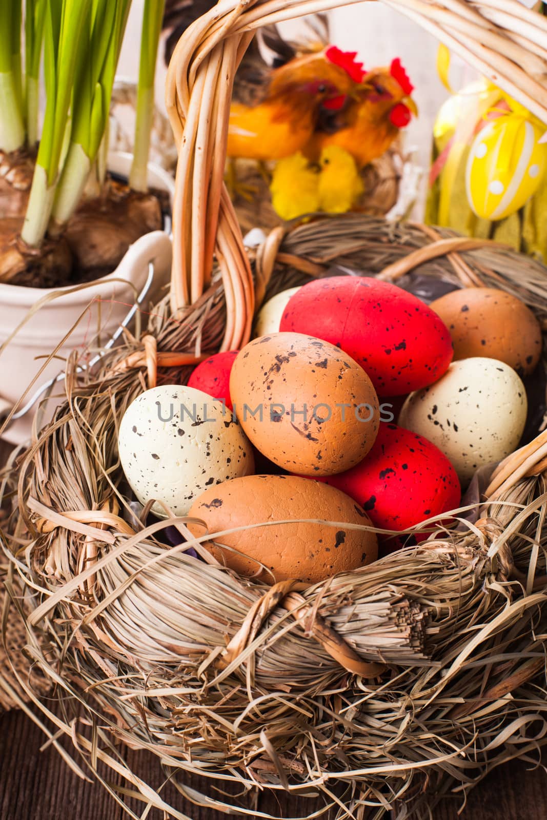 Brown, red and yellow eggs in basket, Easter decor