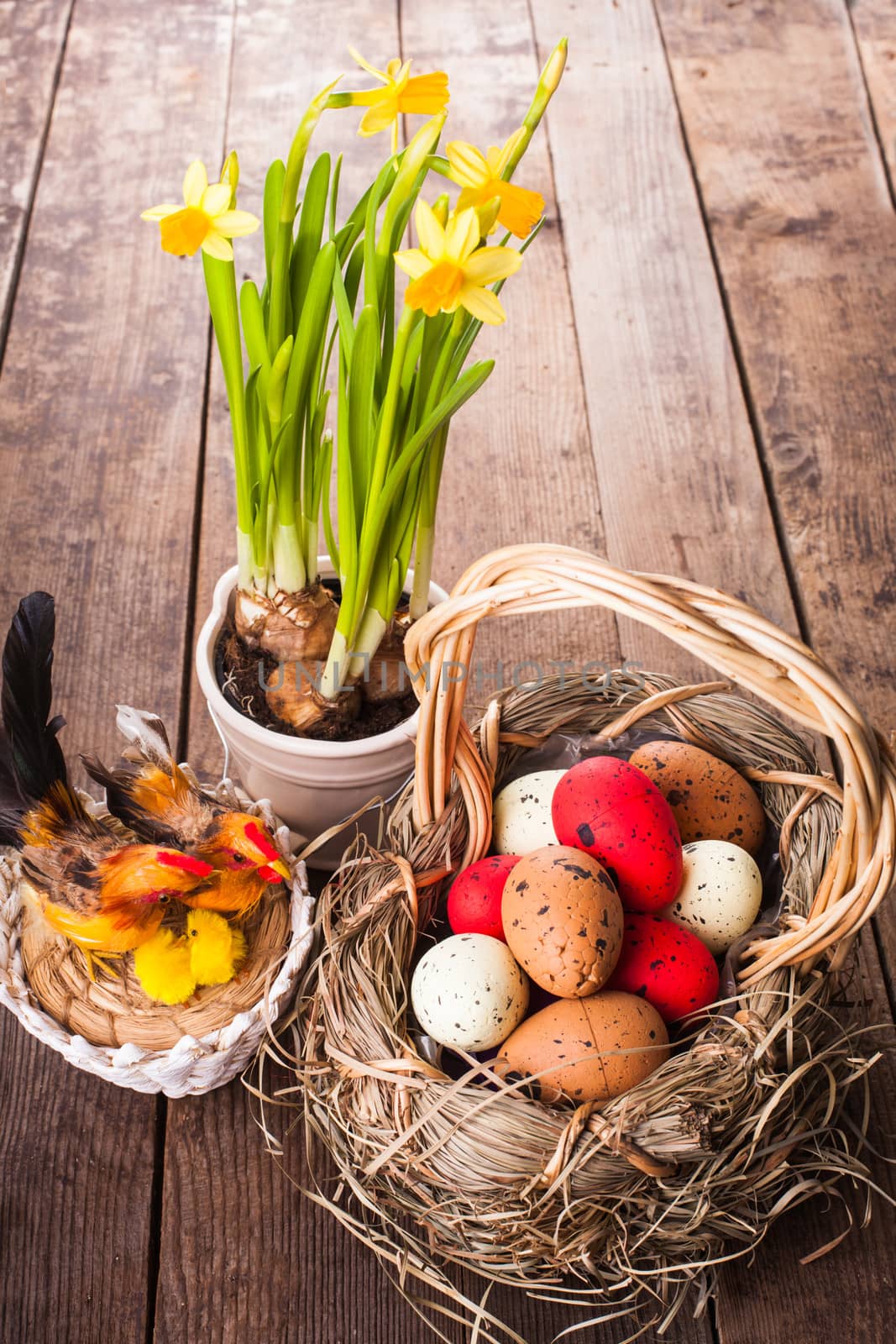 Brown, red and yellow eggs in basket, Easter decor