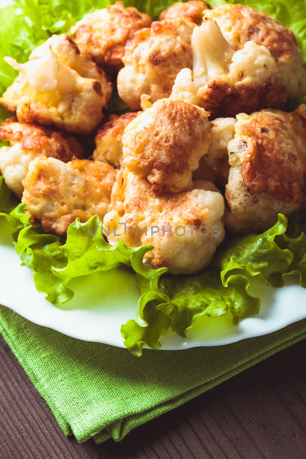 Fried cauliflower closeup on the plate on a table