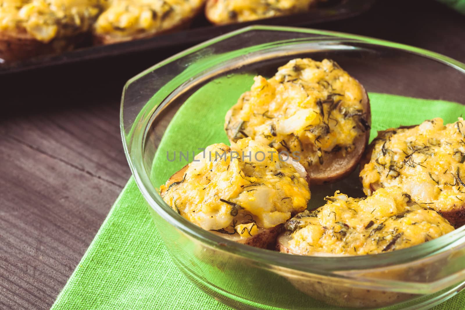 Stuffed baked potato with eggs, cheese and spices