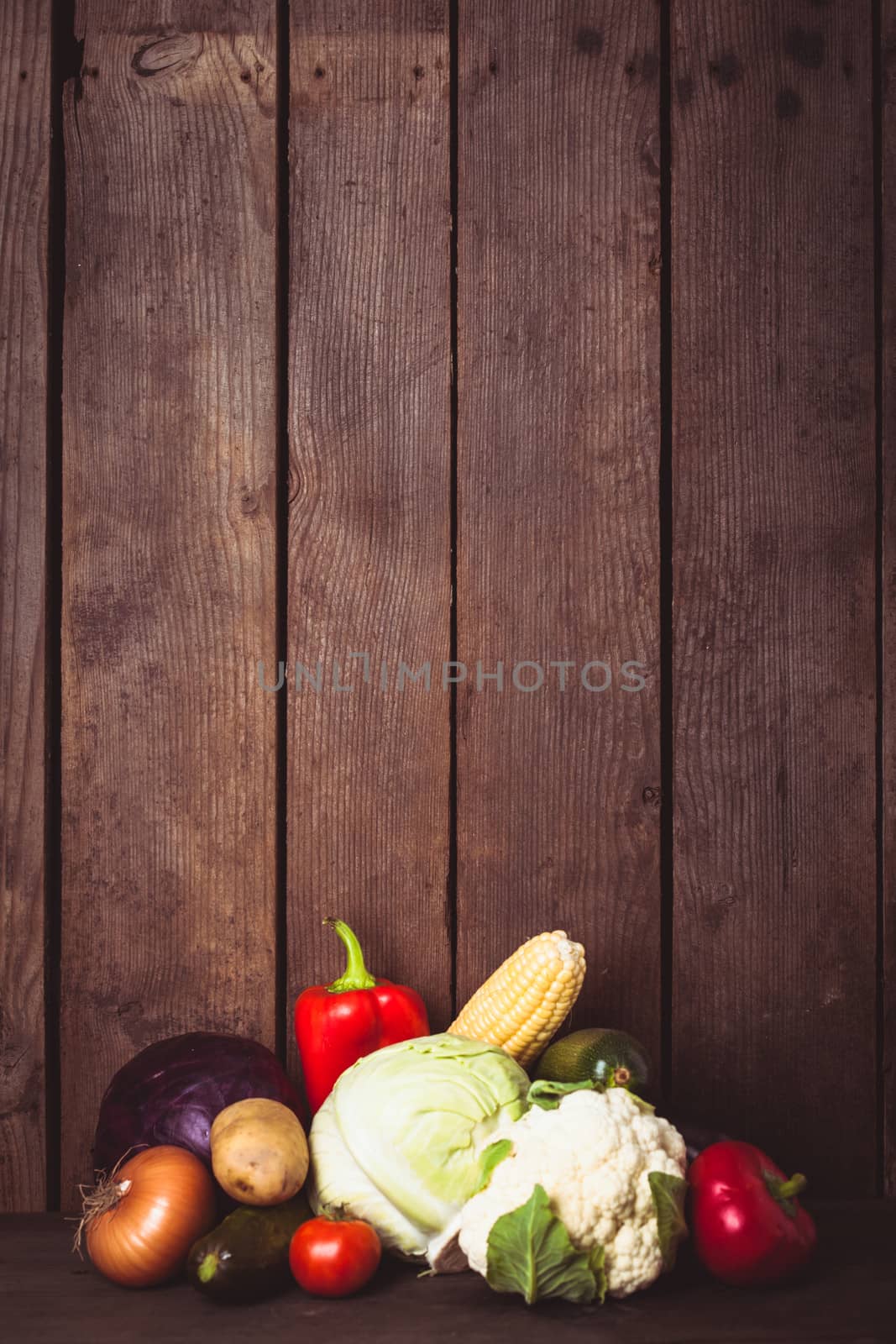 Still life of vegetables on the wood background closeup