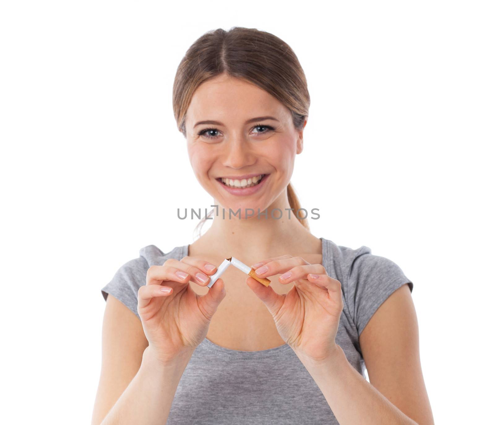 Young woman breaking a cigarette, stop smoking concept