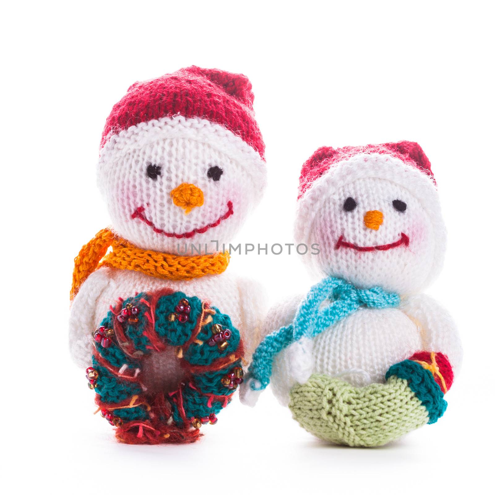 Two knitted christmas  snowmen isolated on white