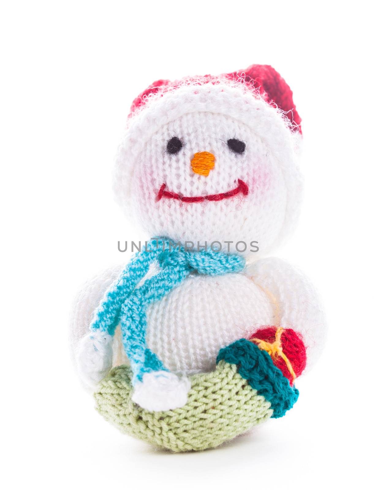 Knitted snowman with christmas santa boot isolated on white