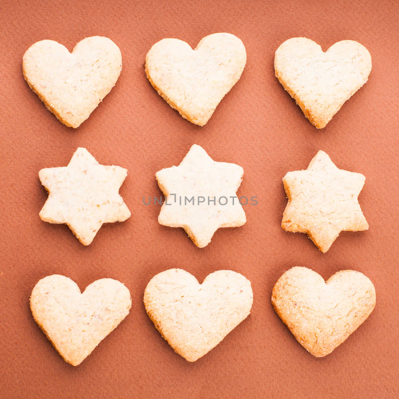 Holiday cookies as a background pattern on brown