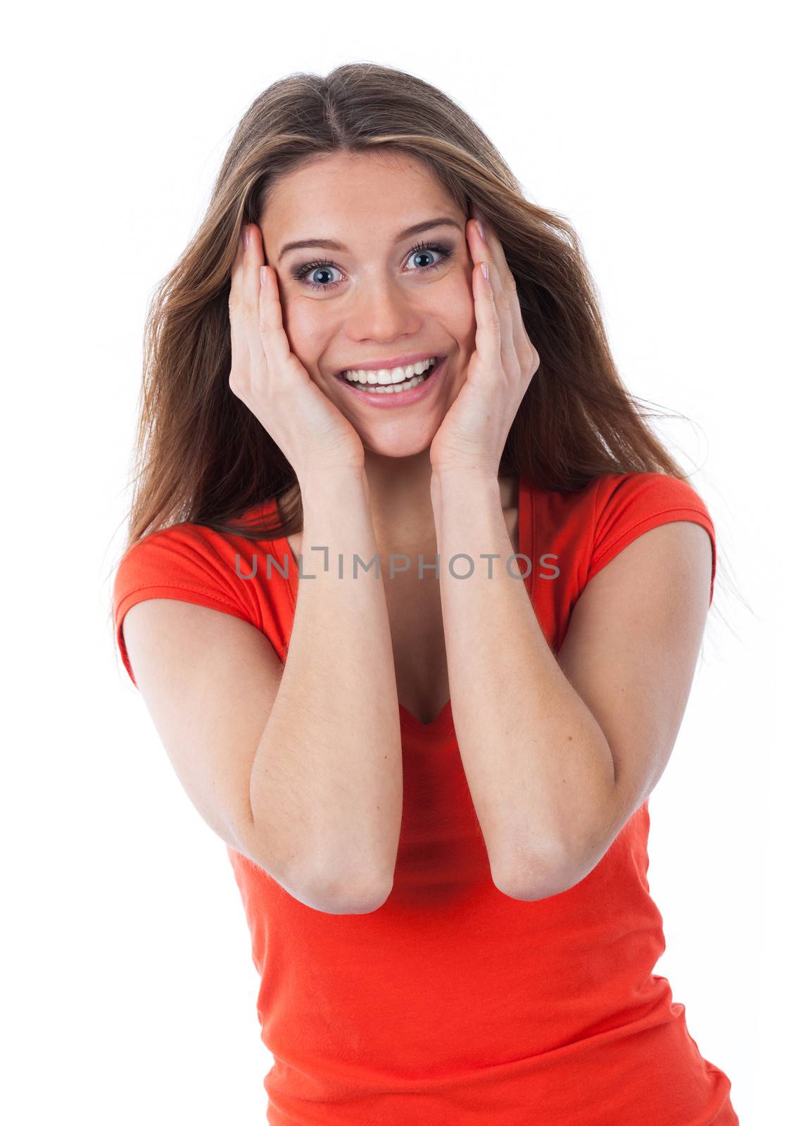 Young woman astonished and holding her face with her hands, isolated on white