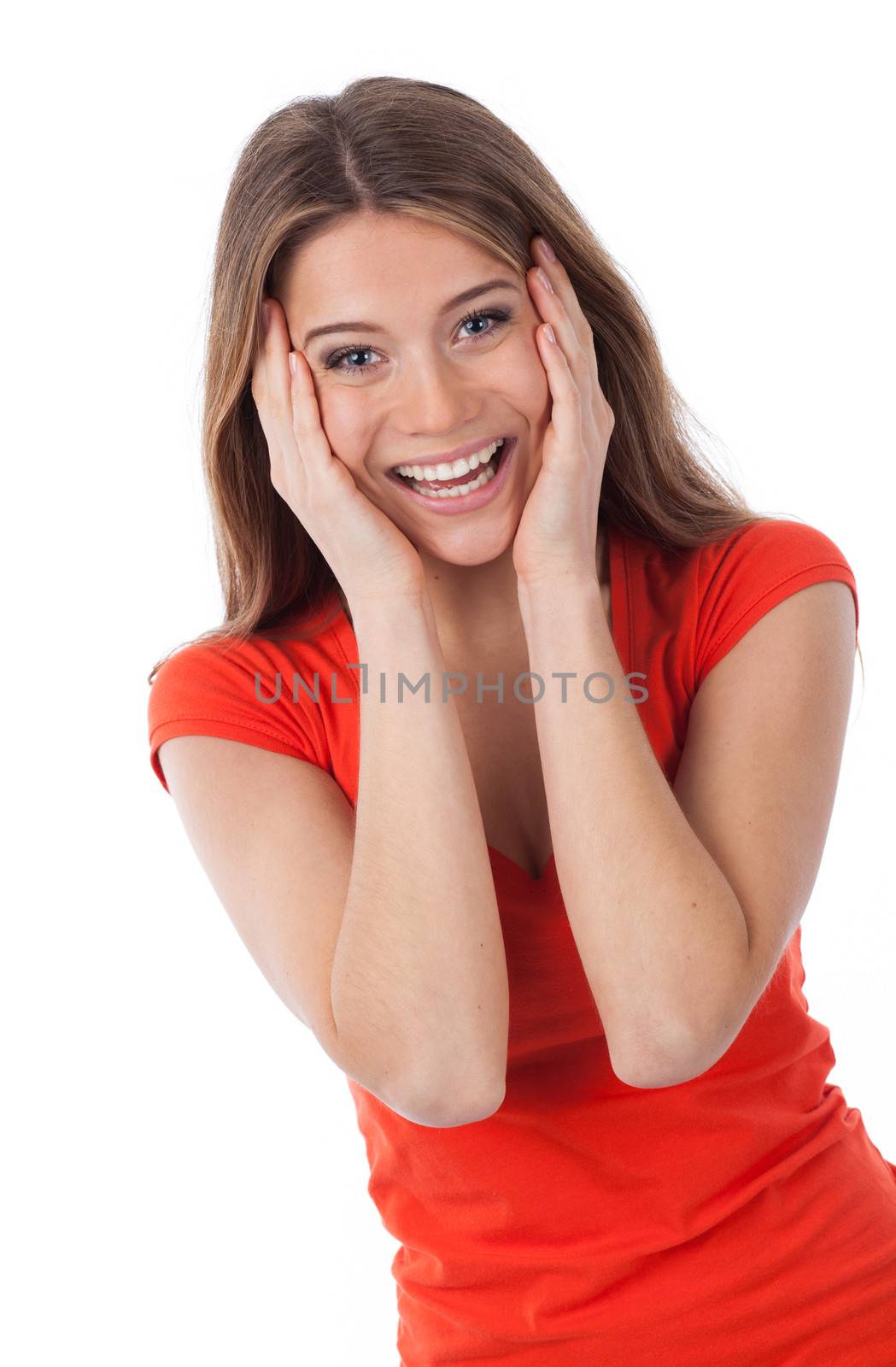 Cheerful woman surprised and holding her face with her hands, isolated on white