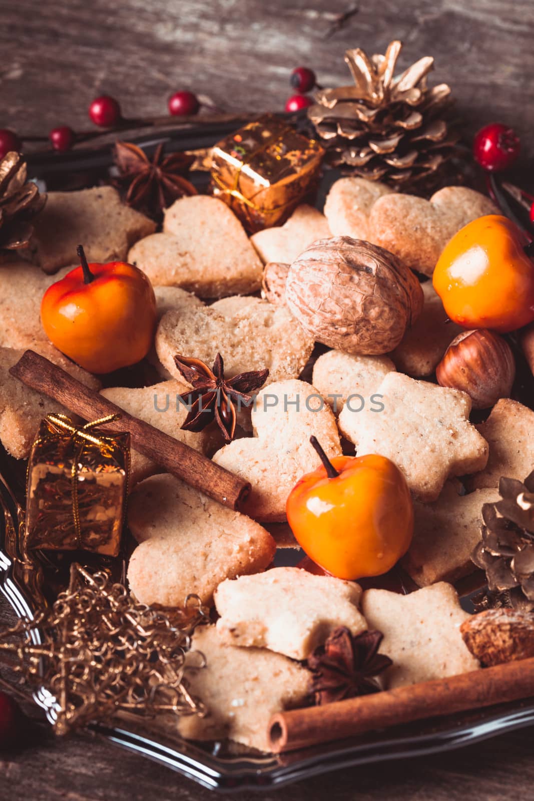 Christmas sweet decor - cookies, apple and spices on the tray