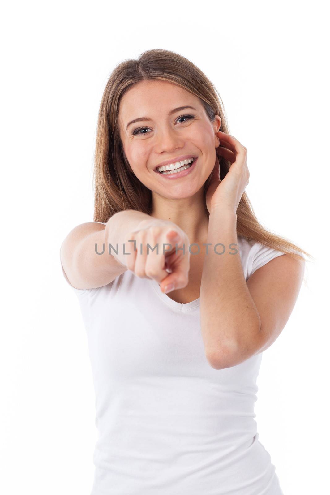 Smiling woman pointing in front of her,  isolated on white