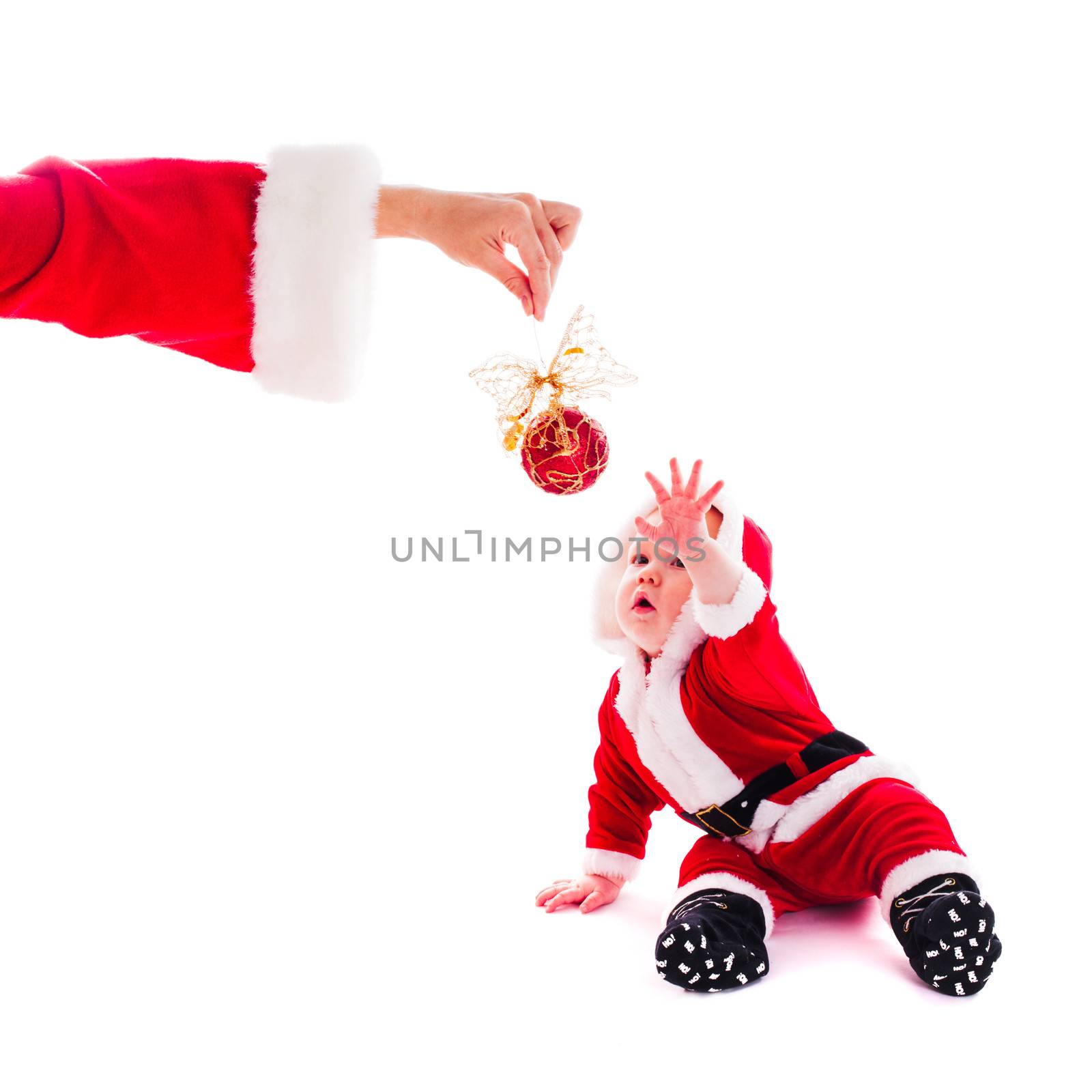 Little Santa boy wants to play isolated on white background