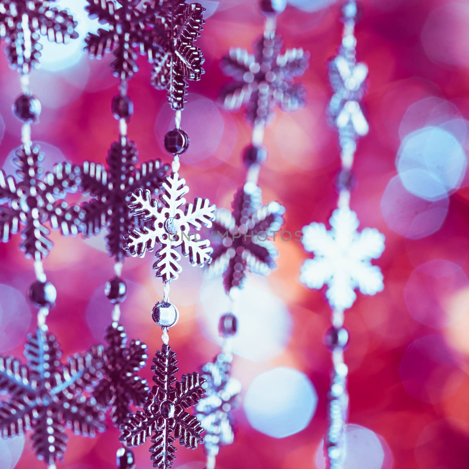 Blue snowflakes on the 
lashing over bokeh background