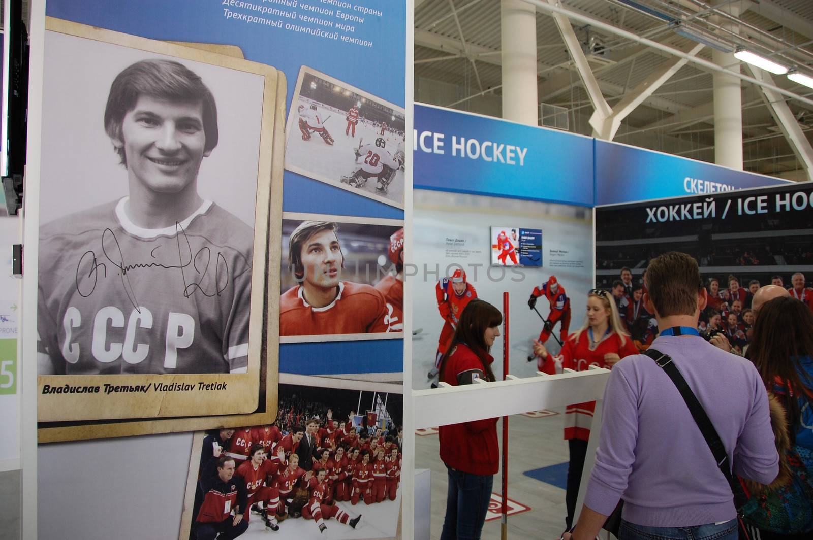 Visitors at ice hockey history exhibition stand by danemo