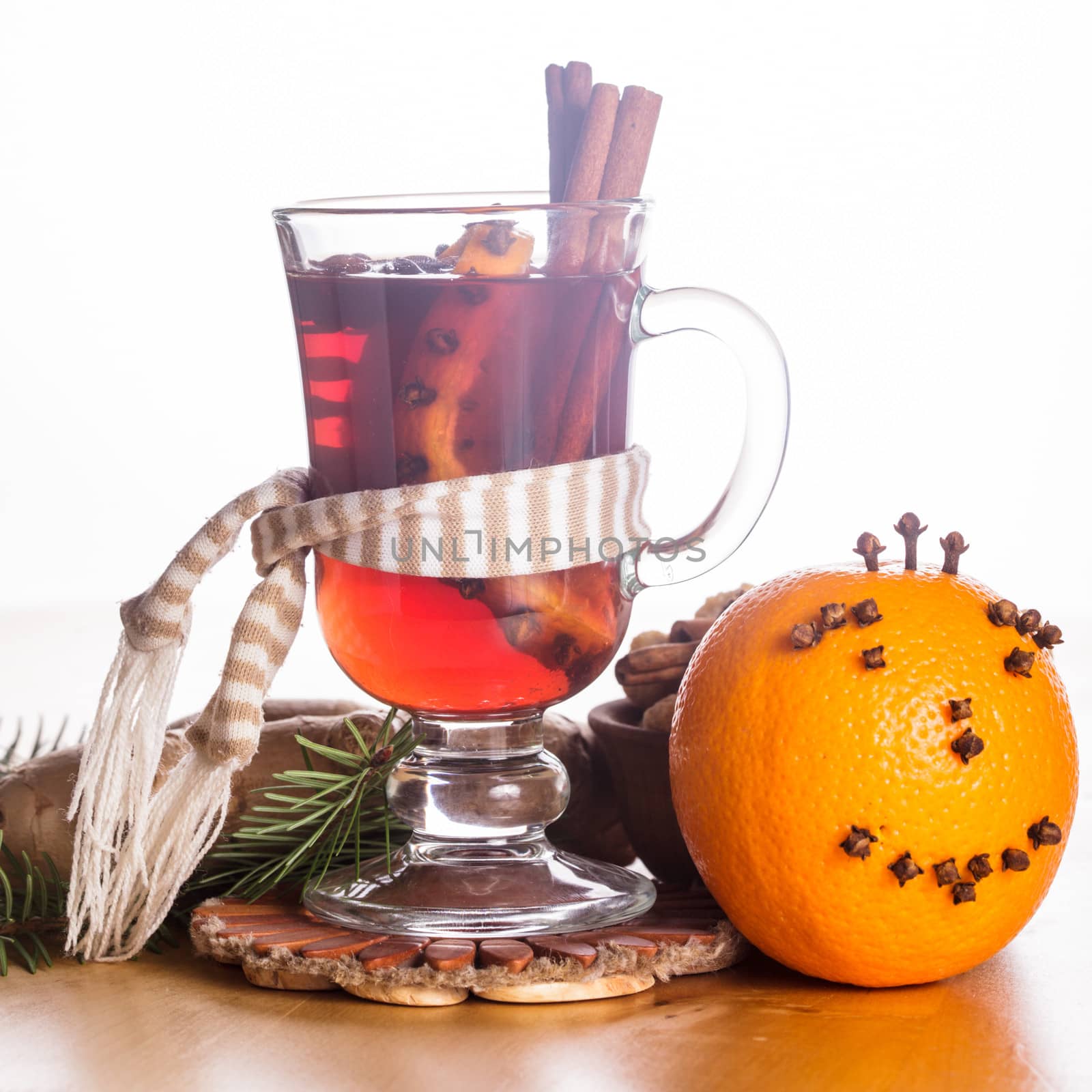 A mulled wine in the glass cup - warming drink