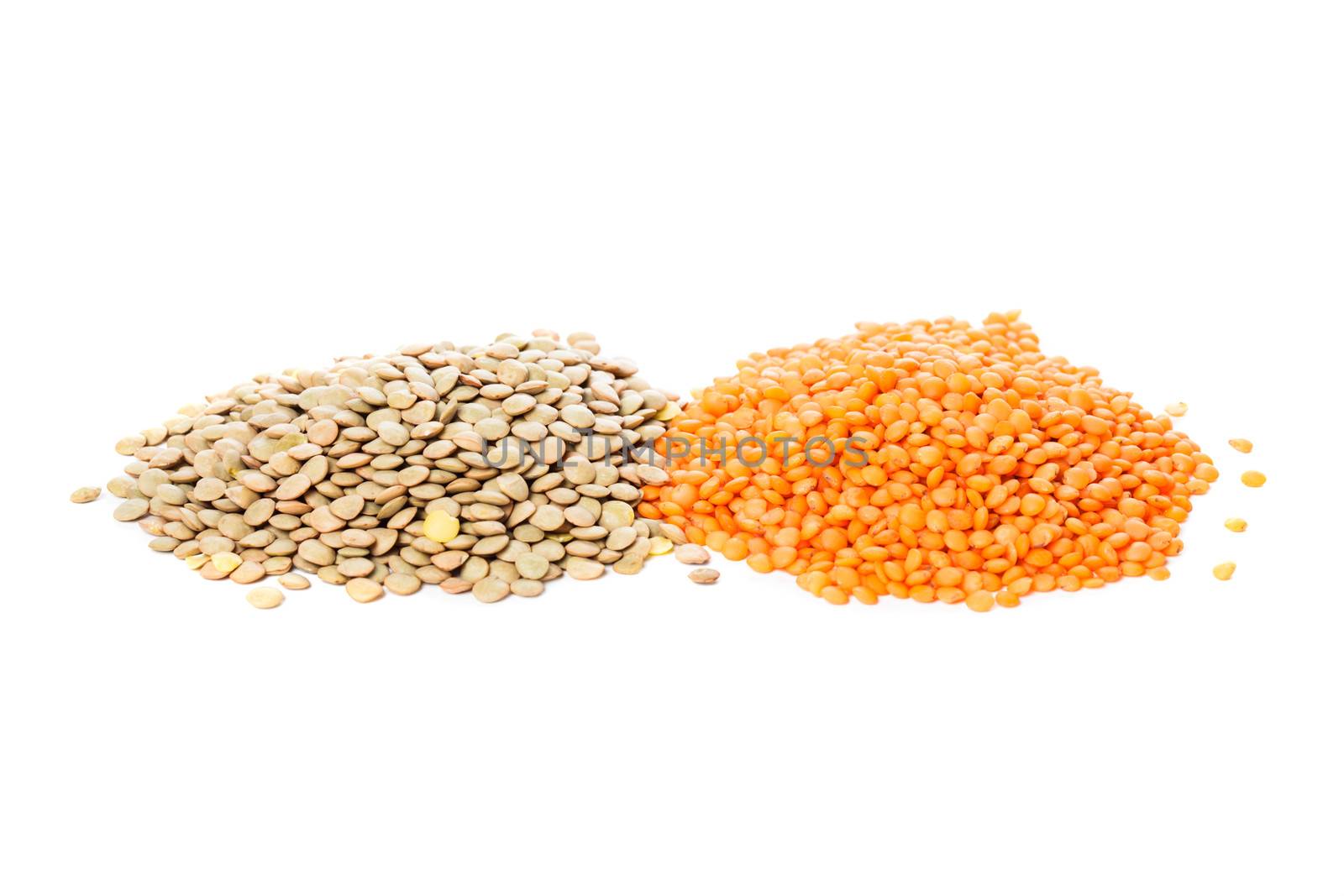 green and red lentils heap isolated on white background