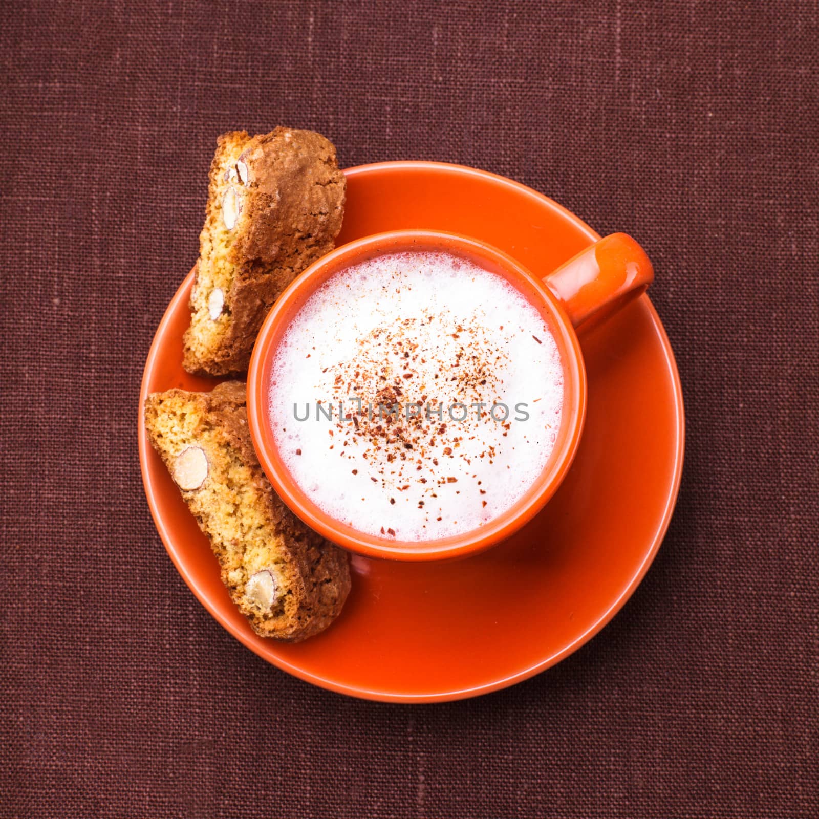 Cantuccini - typical almond cookies with cappuccino cup