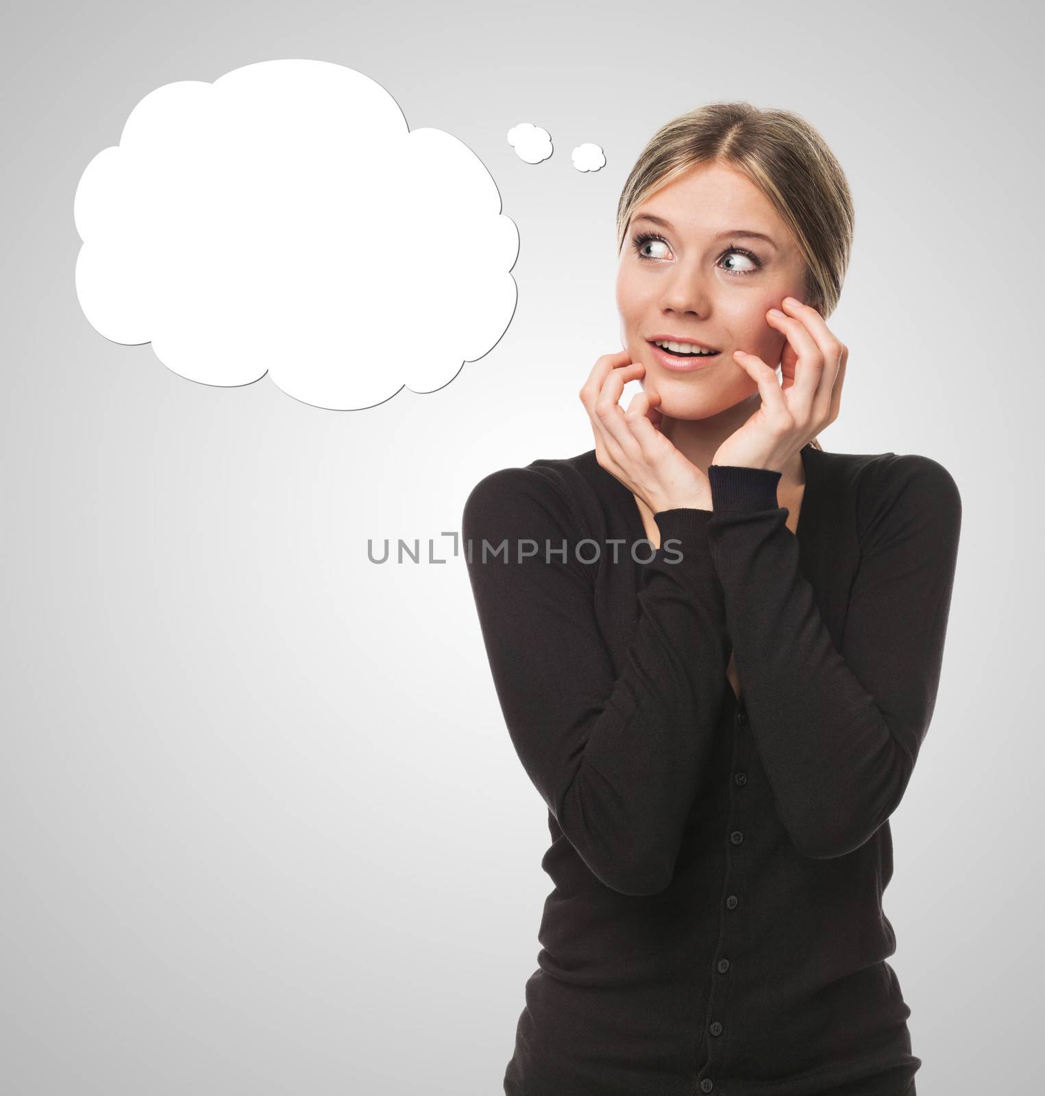 Young woman thinking and looking surprised, with cartoon bubble concept