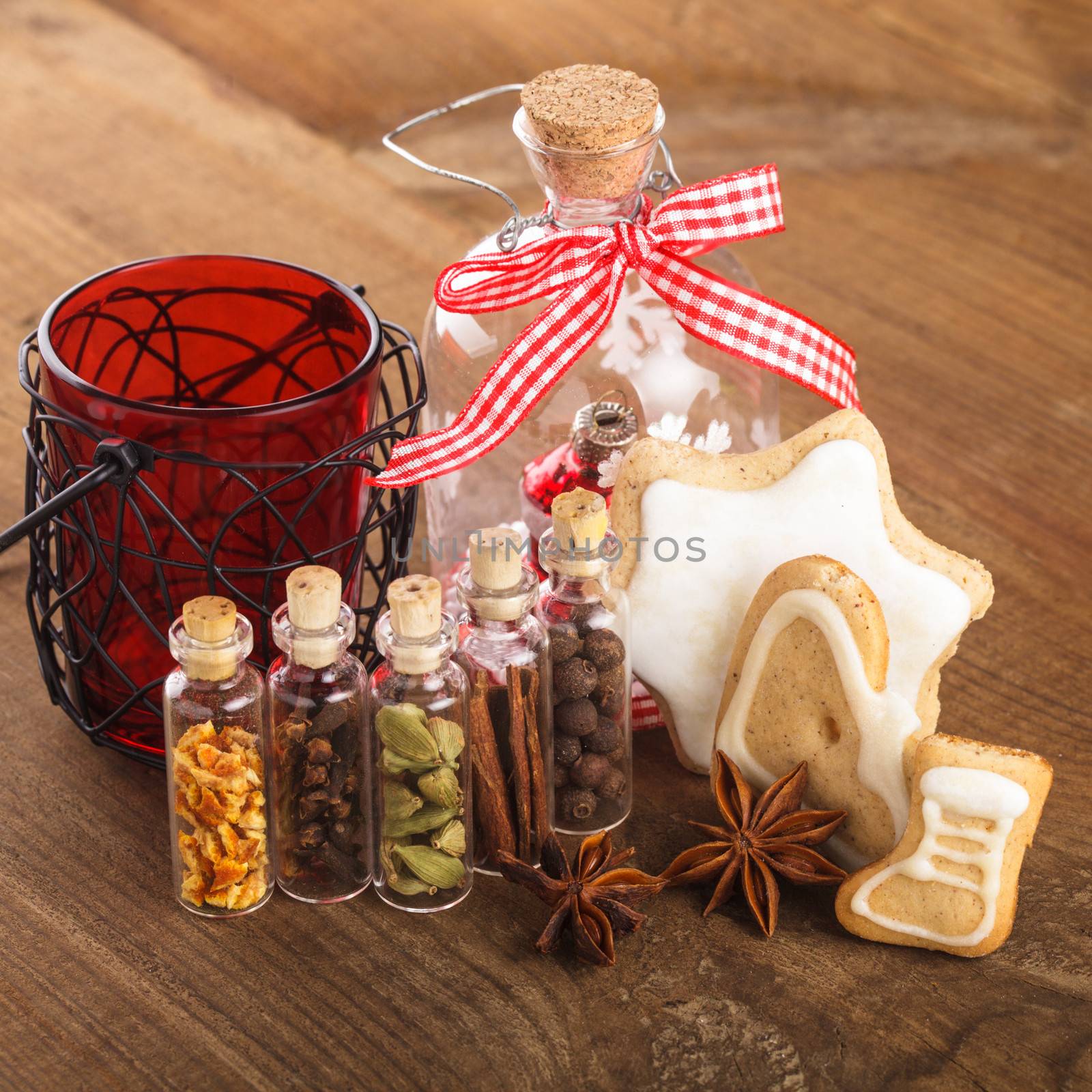 Christmas spices for mulled wine or ginger cookies in small decorative bottles