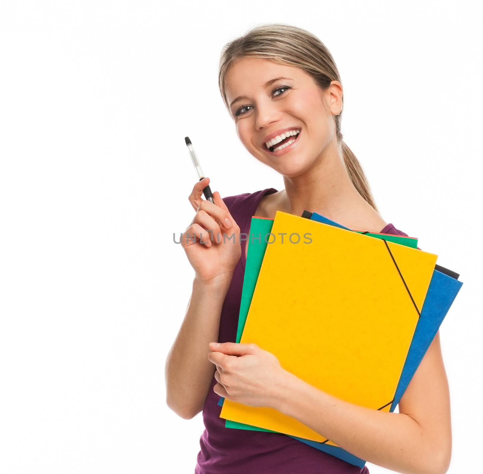 Young student smiling, holding folders and pen, isolated on white