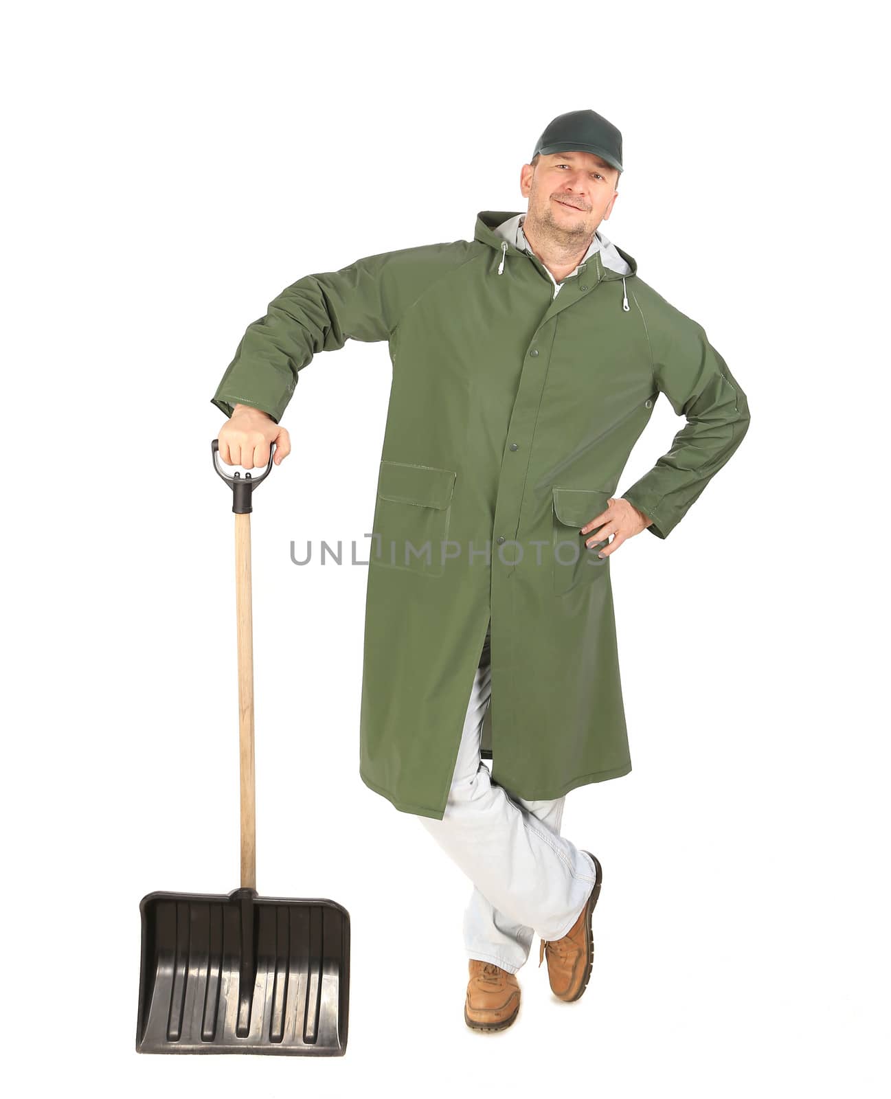 Man in long vest with shovel. Isolated on a white background.