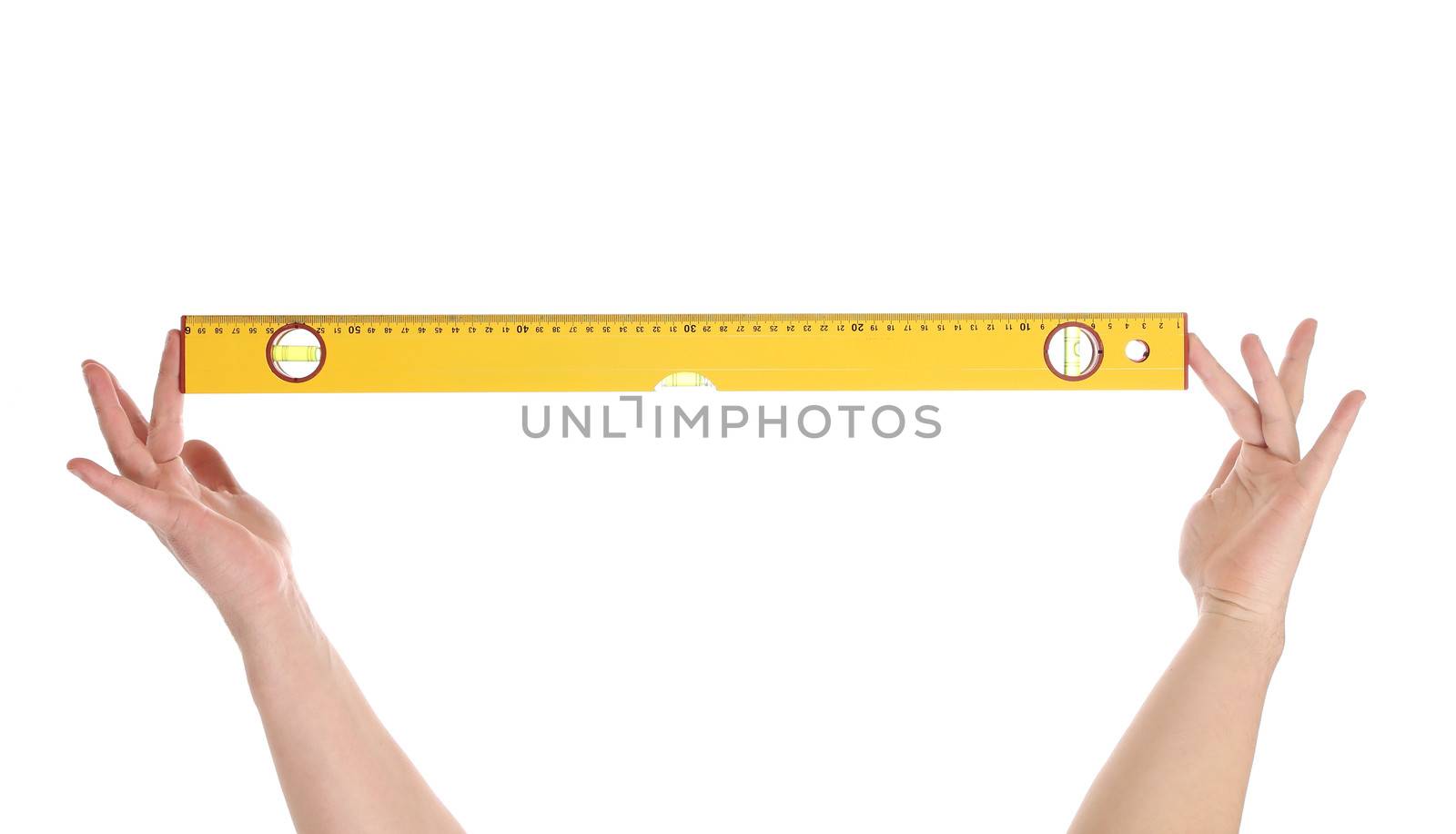Yellow building level in hands. Isolated on a white background.