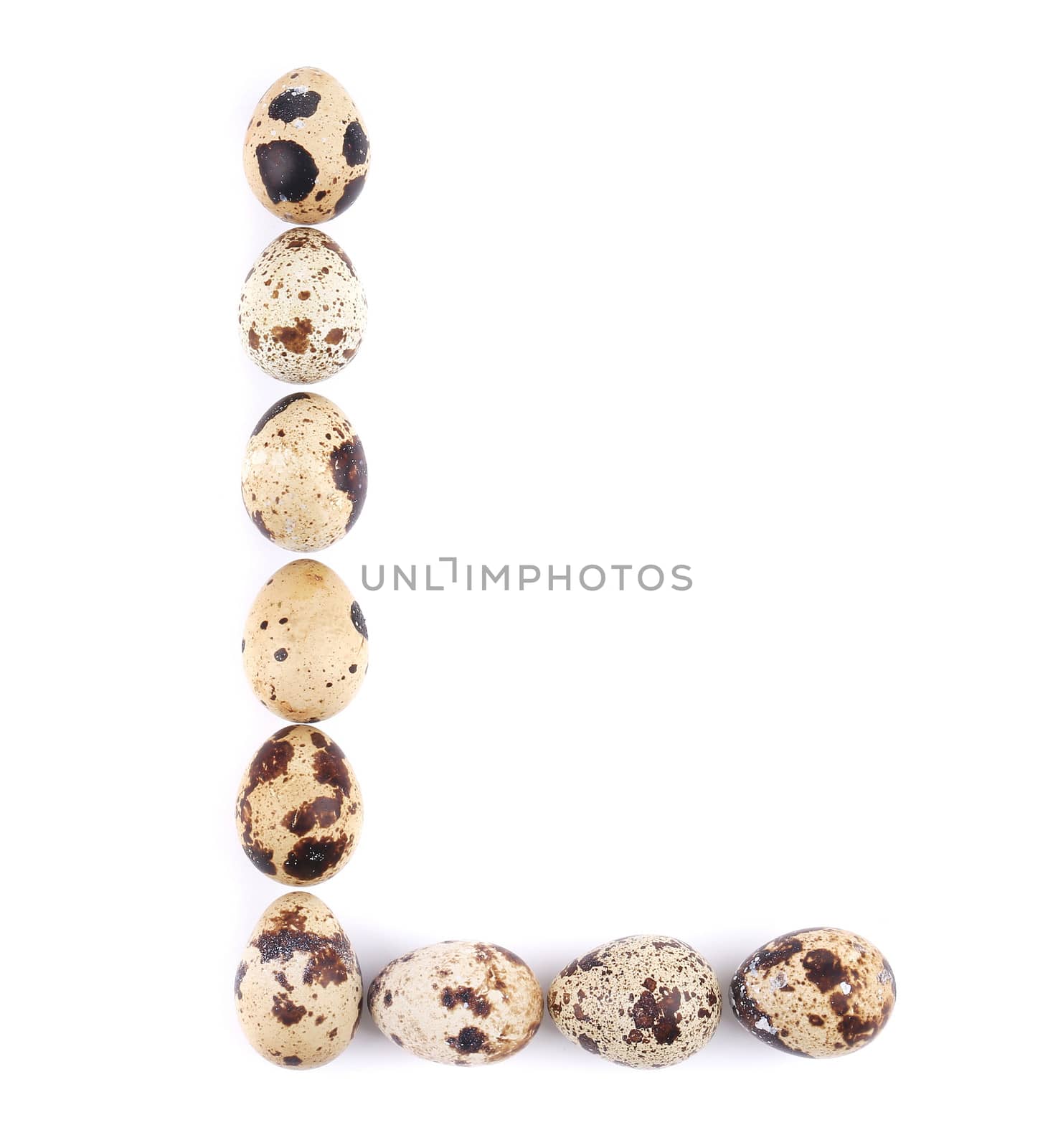 quail eggs in the form of letter L. Isolated on a white background
