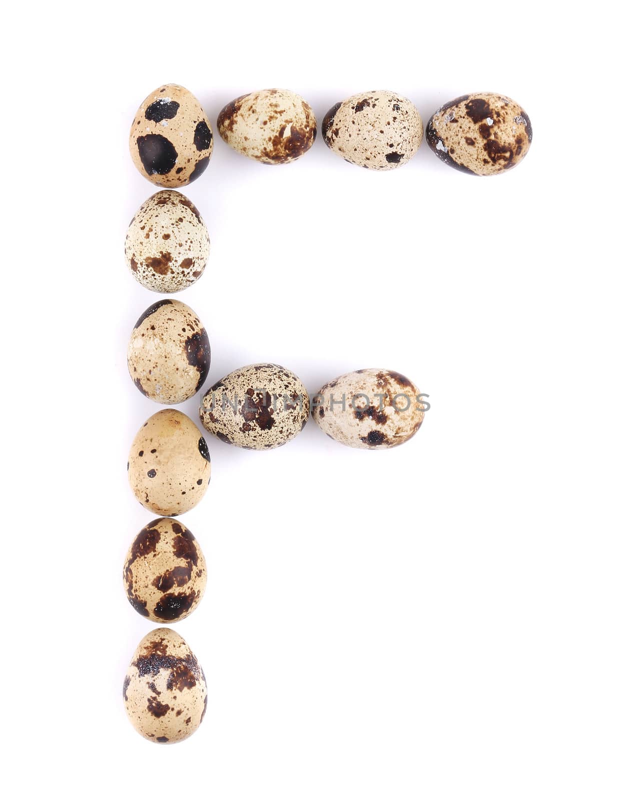 quail eggs in the form of letter F. Isolated on a white background