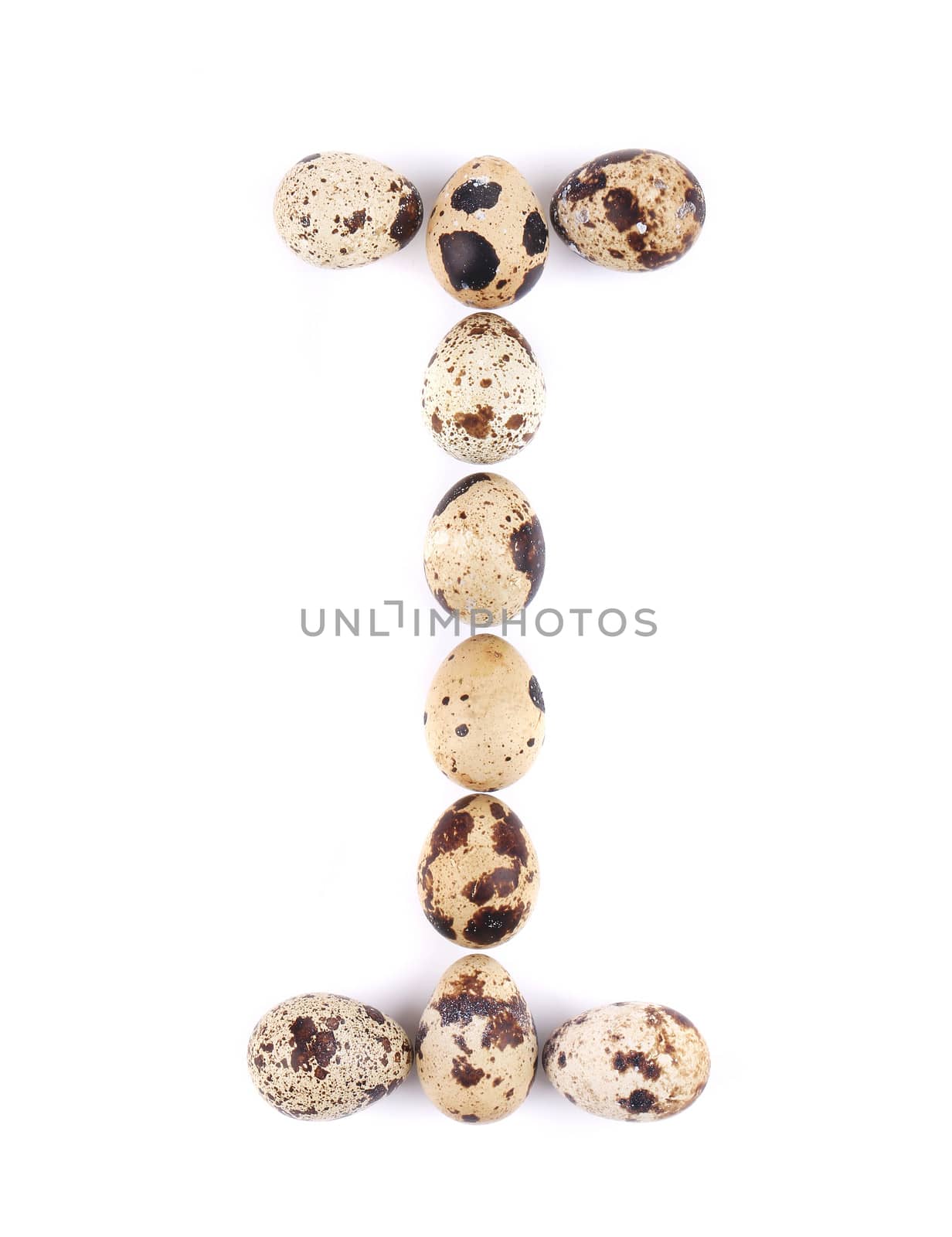 quail eggs in the form of letter I. Isolated on a white background