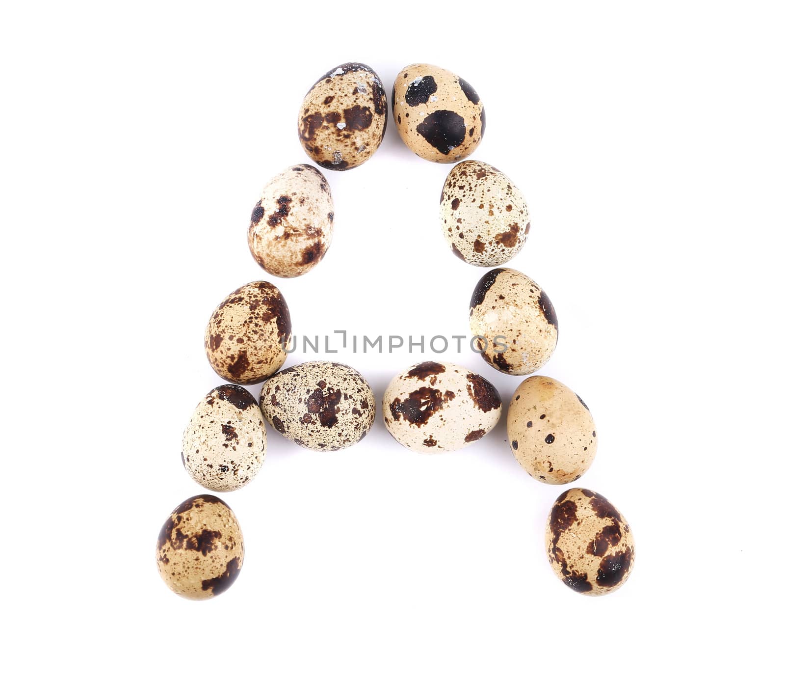 quail eggs in the form of letter A. Isolated on a white background