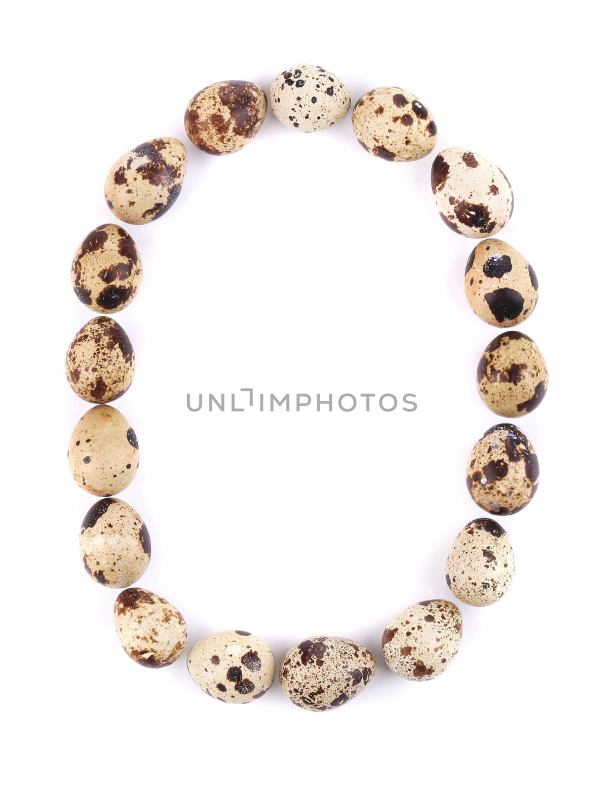 quail eggs in the form of letter O. Isolated on a white background