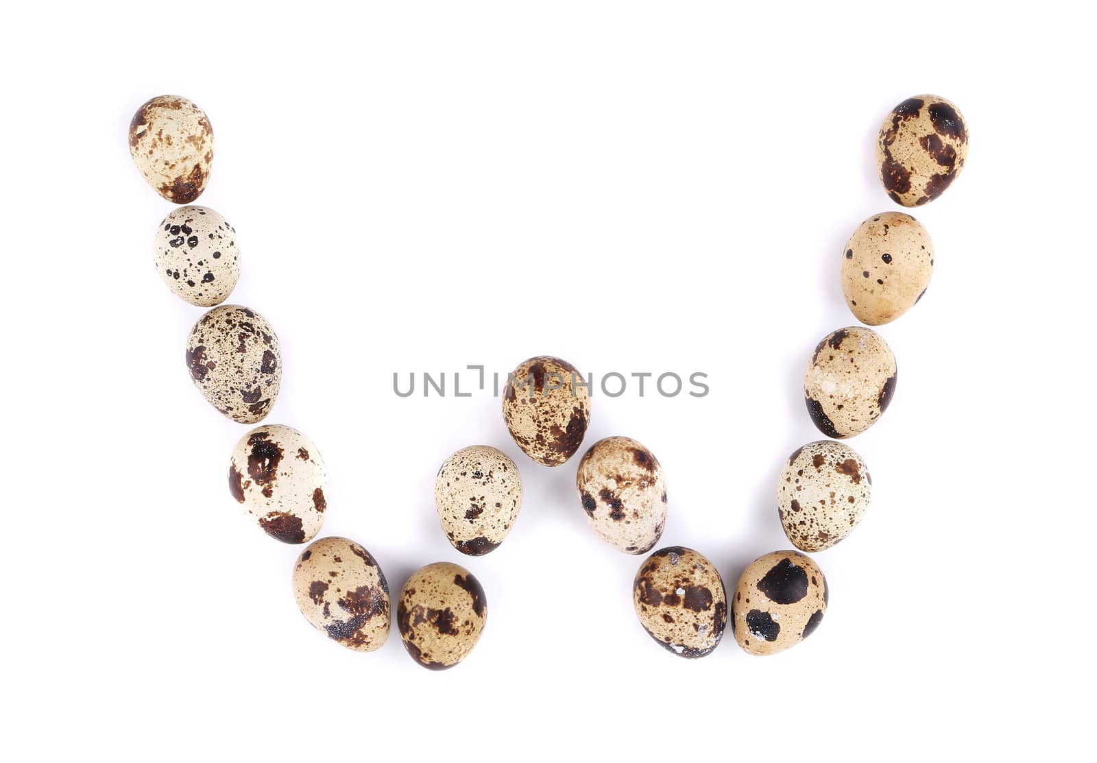 quail eggs in the form of letter W. Isolated on a white background