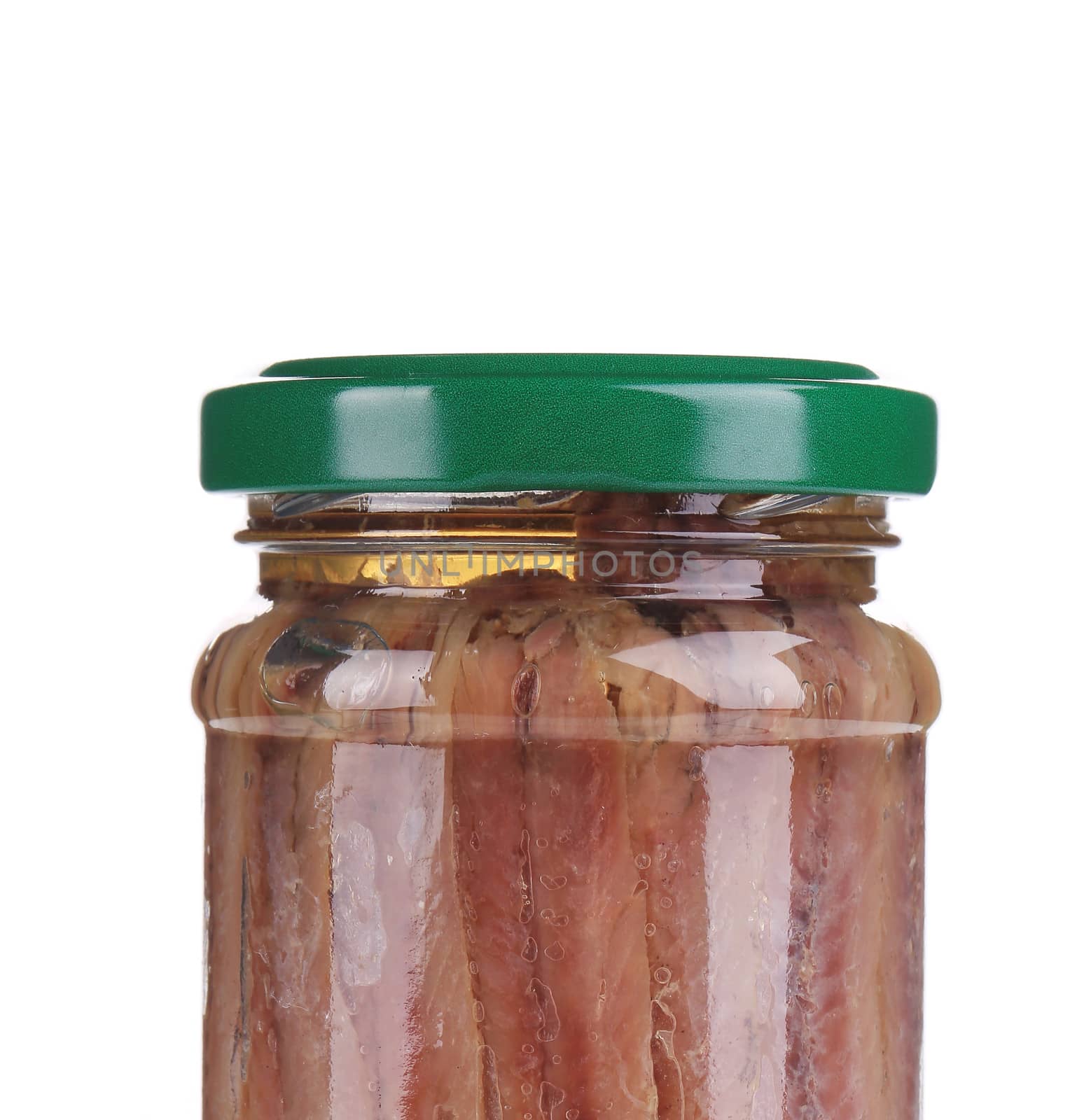 close up of jar of anchovy fillets. isolated on white background.