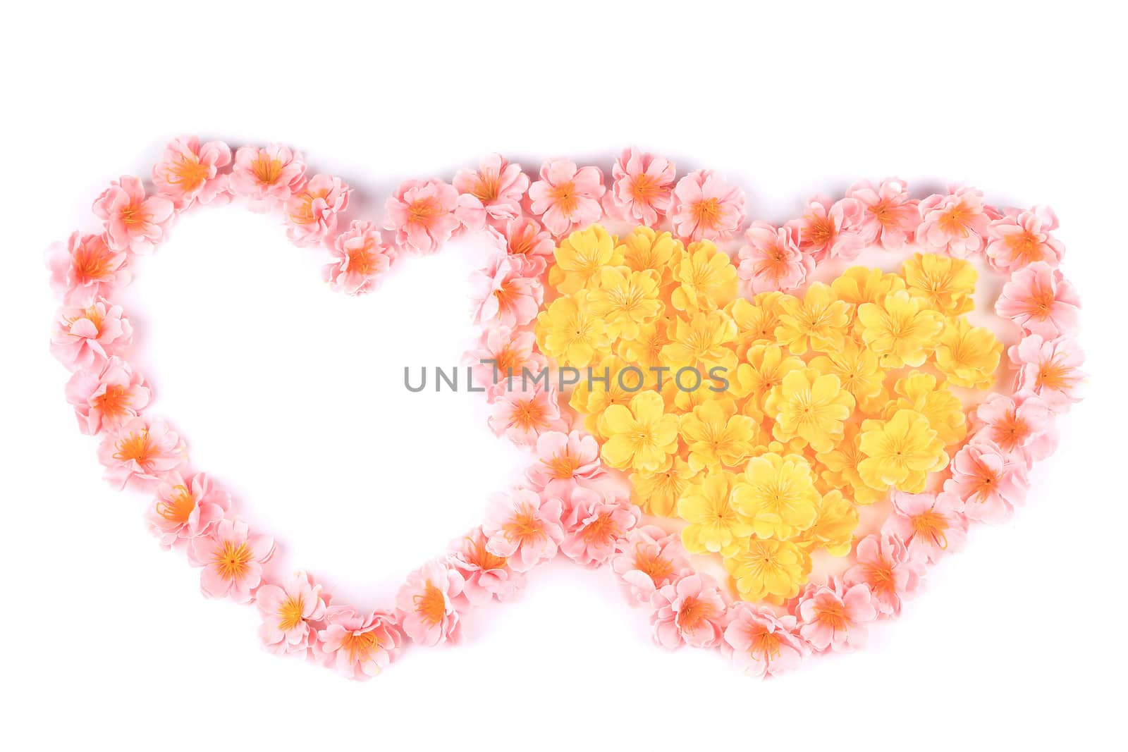 Two hearts made ??of artificial flowers. Isolated on a white background.