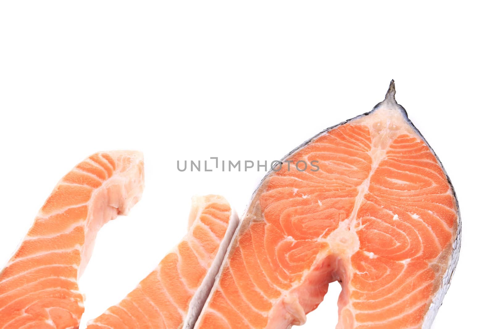 Two pieces of salmon. On a white background.