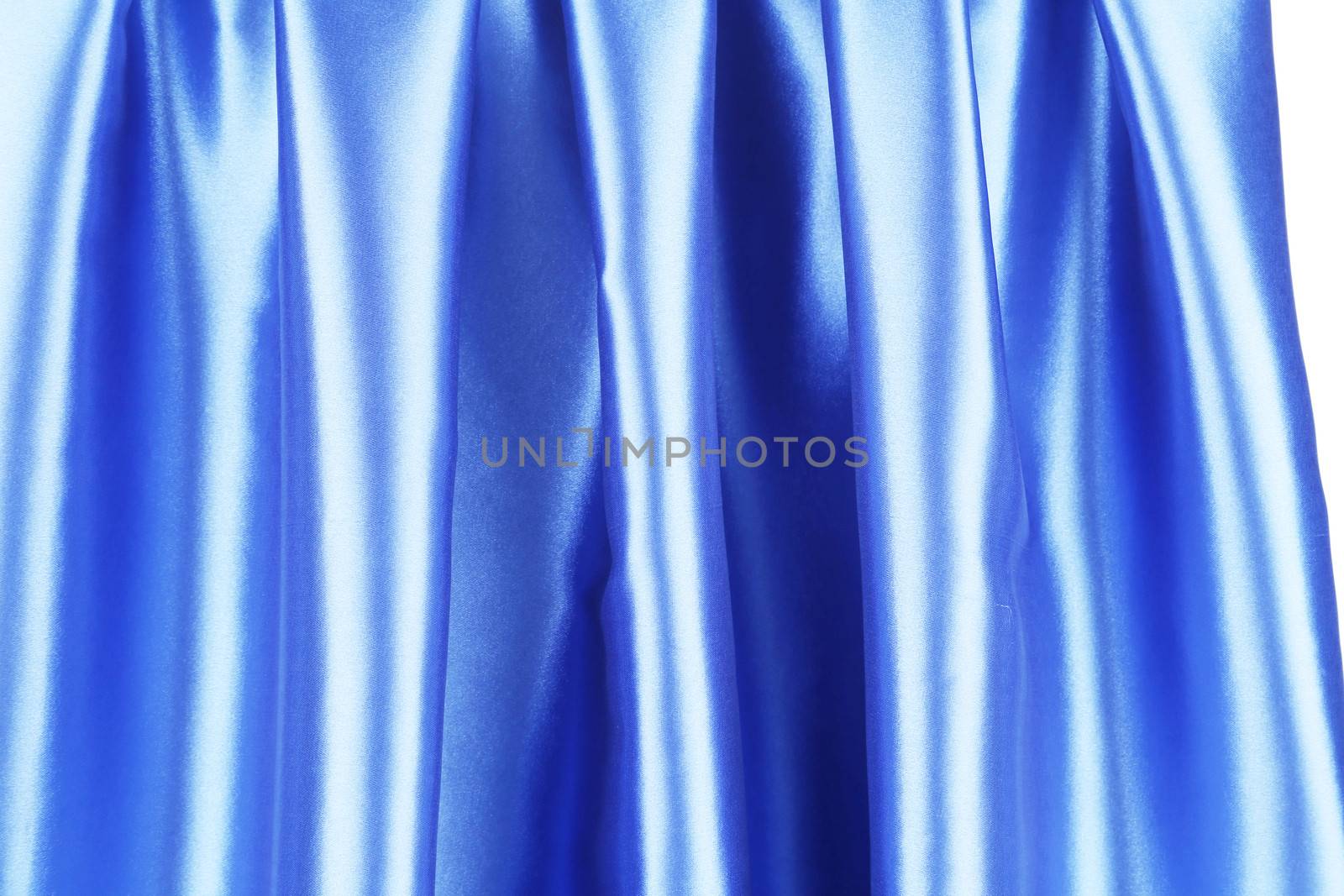 Creases in blue fabric. Isolated on a white background.