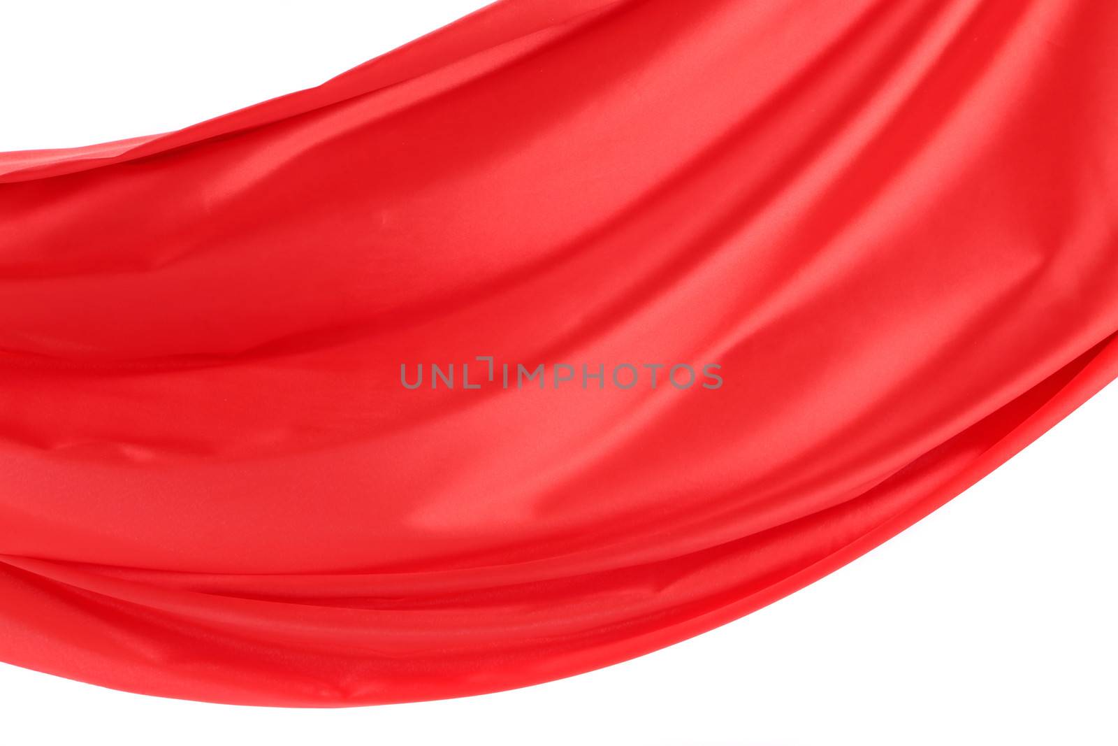 Wave of red satin on a white background. On a white background.