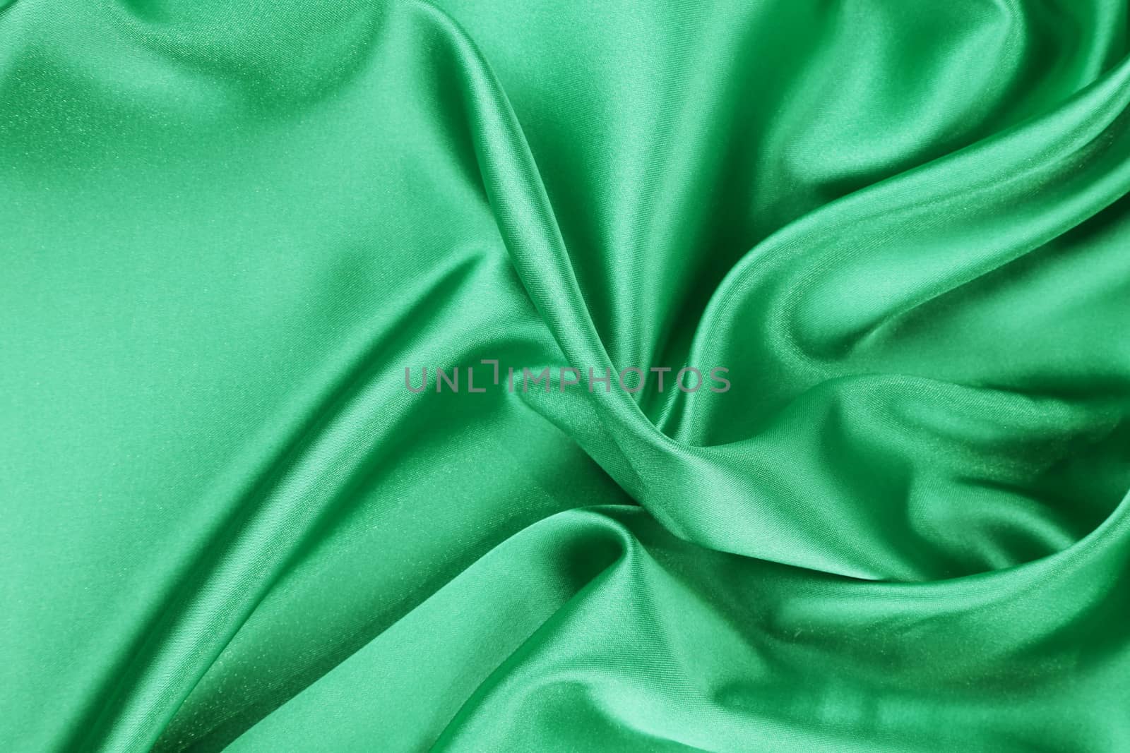 Smooth elegant emerald silk. To be used as background.