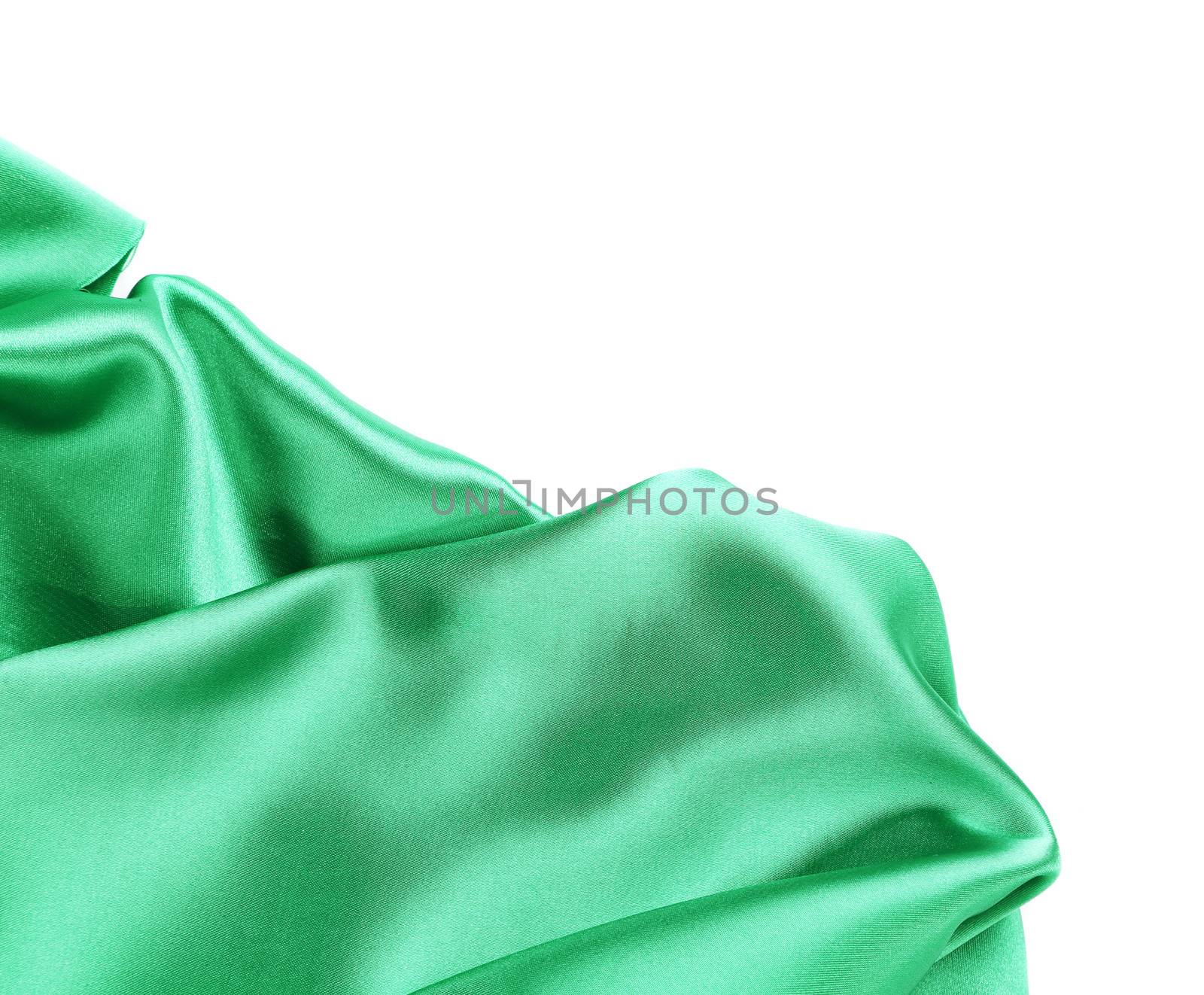 Folds of emerald satin. On a white background.